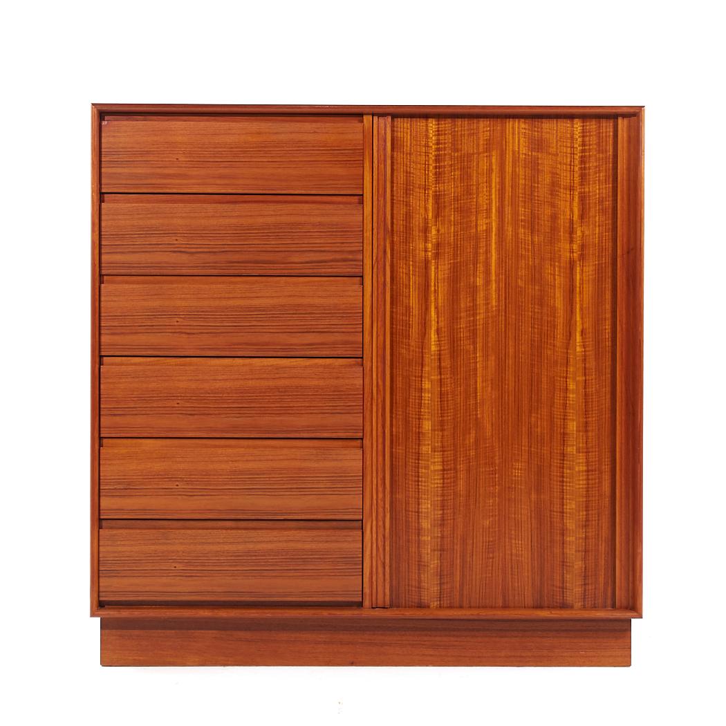 Danflex Mid Century Teak Tambour Armoire Gentlemans Chest Dresser

This armoire measures: 49 wide x 19 deep x 50 inches high

All pieces of furniture can be had in what we call restored vintage condition. That means the piece is restored upon