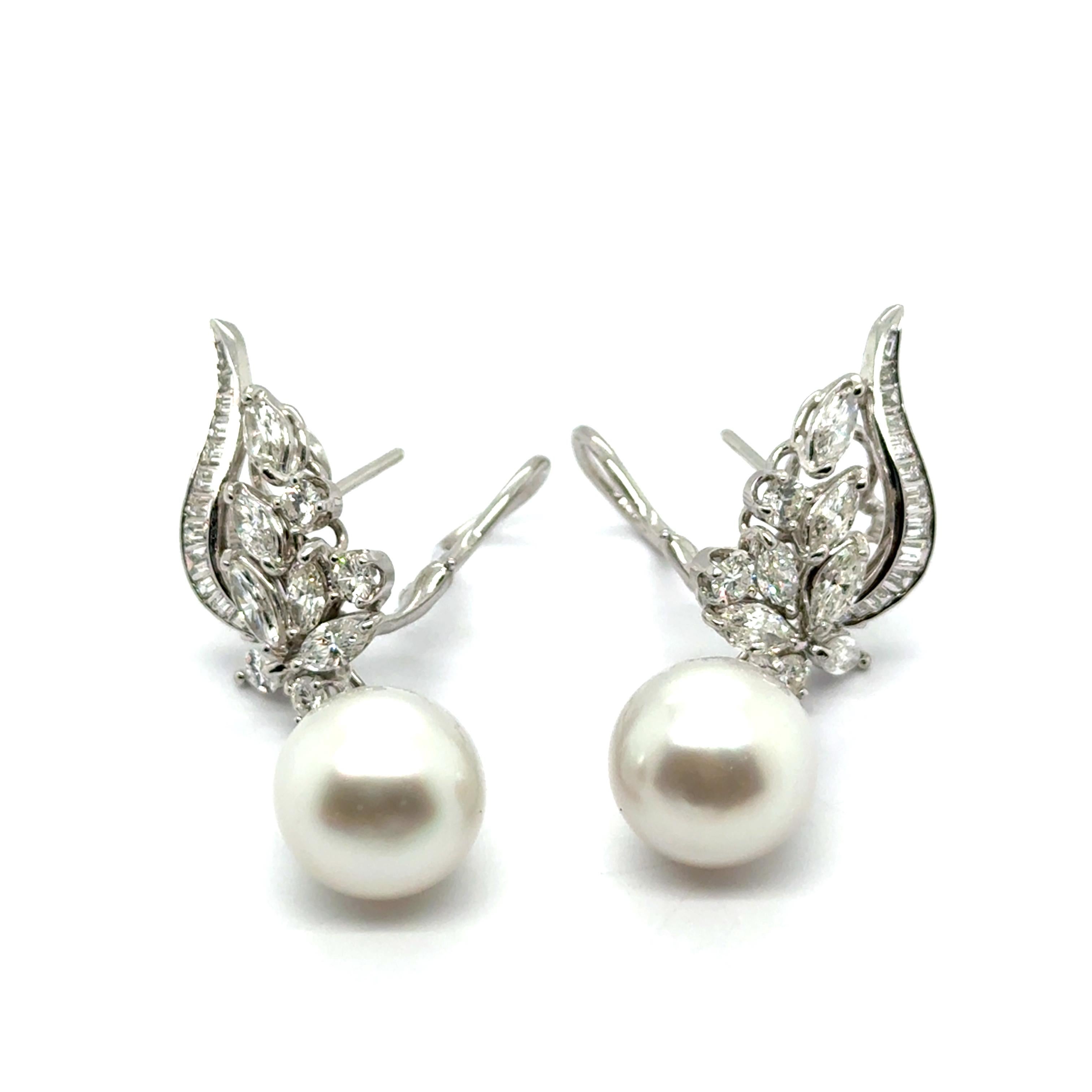 Timeless and refined, these earrings dangle earrings with diamonds & South Sea pearls in platinum are designed to enchant and inspire.

A perfect balance of elegance and brilliance, they shine with 68 dazzling diamonds in a mix of cuts, totaling