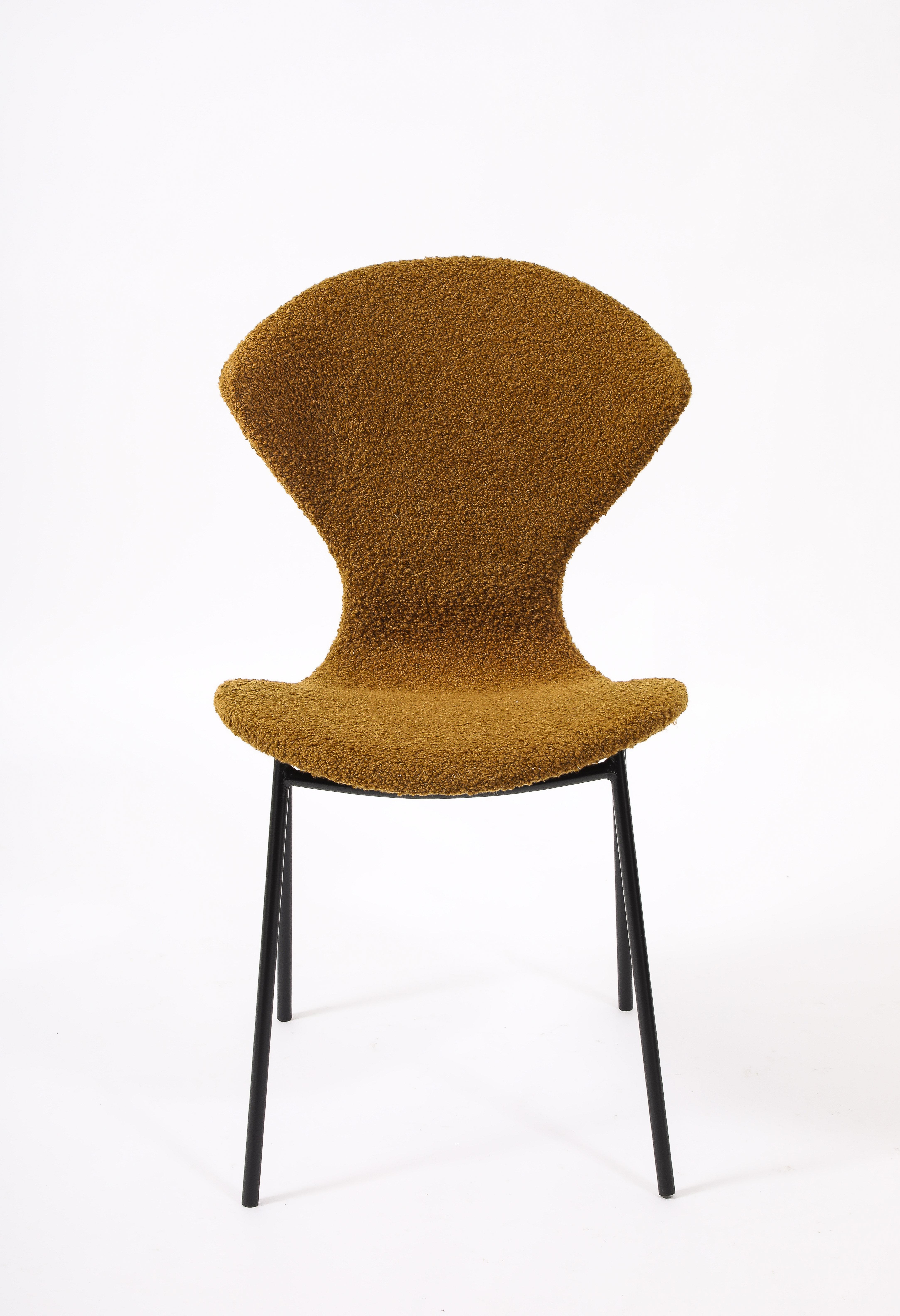 Side chairs by D&D for Stafor, the seat is molded plywood. Sits very nicely, with black enameled legs.