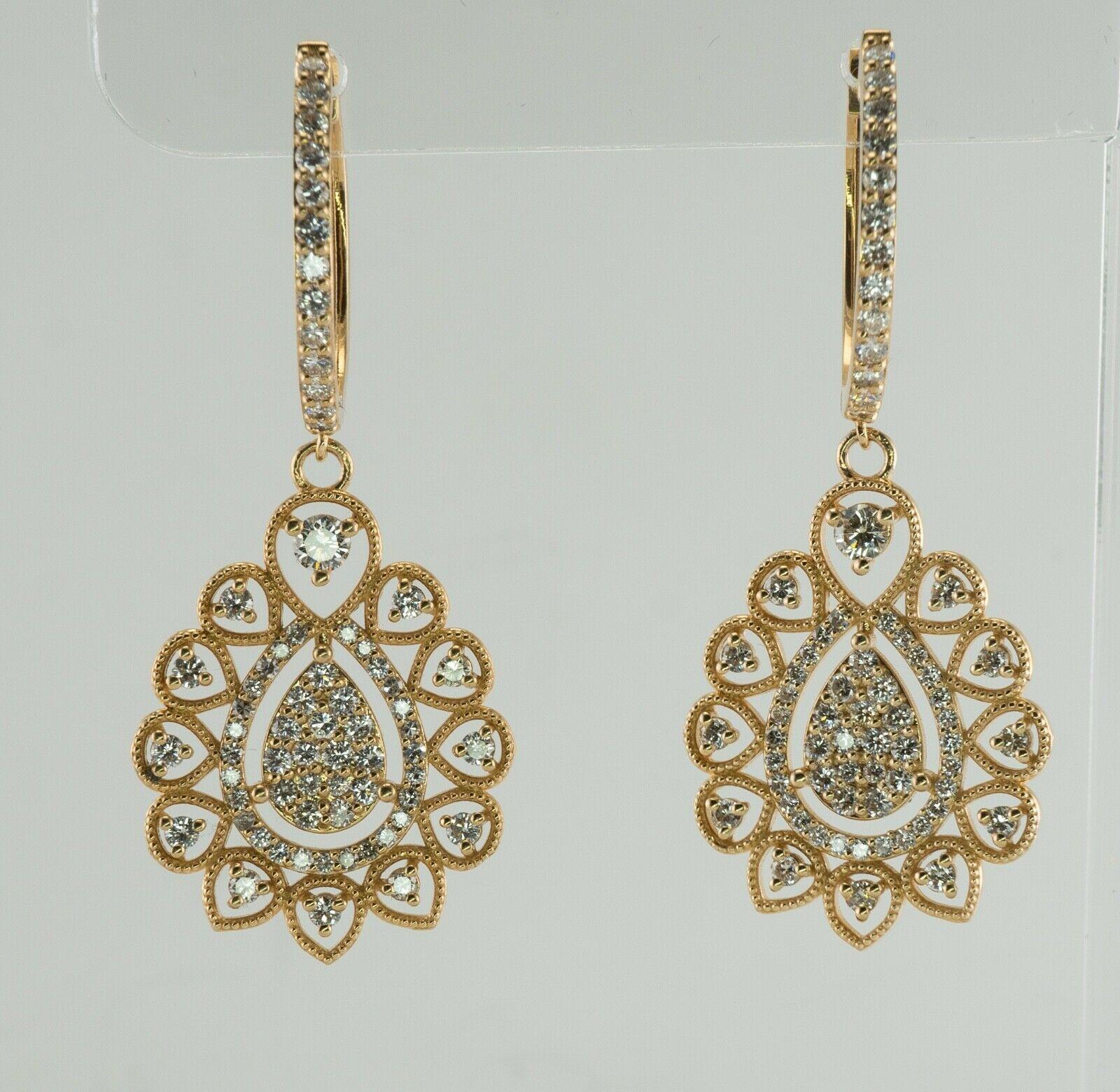 These estate earrings are crafted in solid 14K Yellow Gold (carefully tested and guaranteed).
The gorgeous millgrained dangle part of the earring holds 57 round diamonds plus 11 diamonds on the top.
The total diamond weight for the pair is 2.08