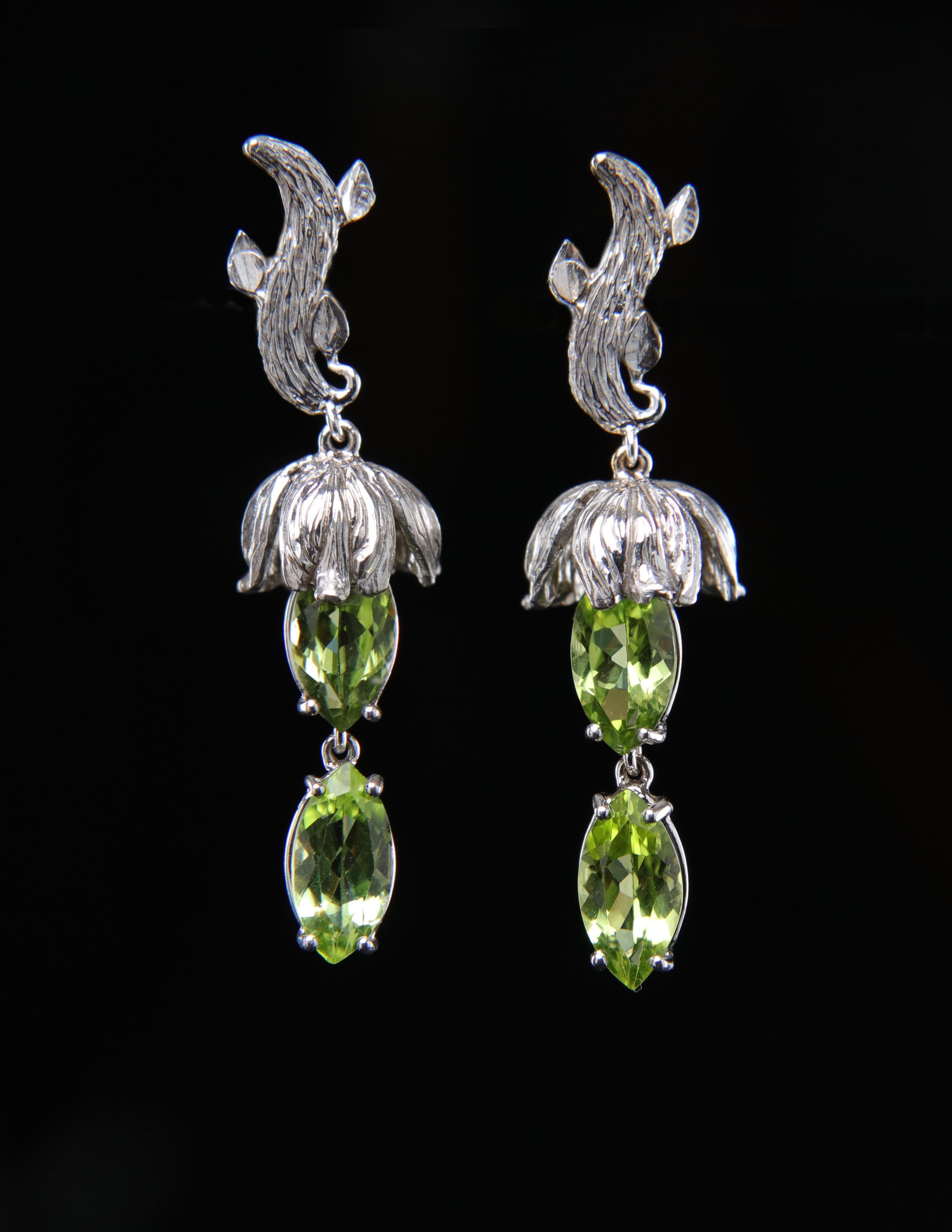 The peridot in this white gold earring has a past. Scientist found it in solar dust dating back to the formation of our solar system.  Now, peridot is found around the world including in: lava flows in Hawaii, on the San Carlos Apache Indian