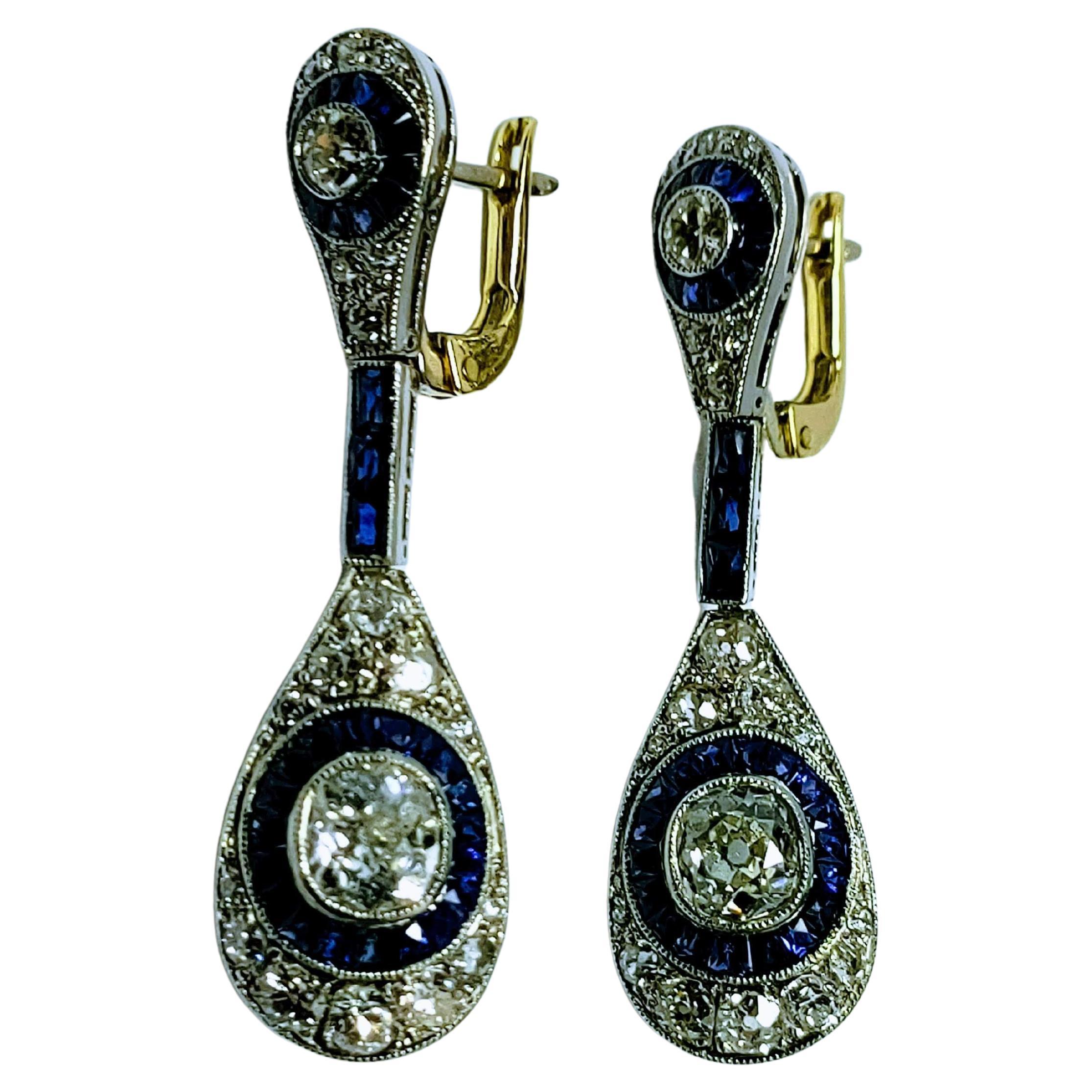 Magnificent and sophisticated Art deco 1930s earrings made of platinum, weight 8.72 grams. It consists of two pieces in the form of articulated pears, at the bottom two old mine cut diamonds of 6.5x5.8x3 millimeters individual weight 0.70 carats