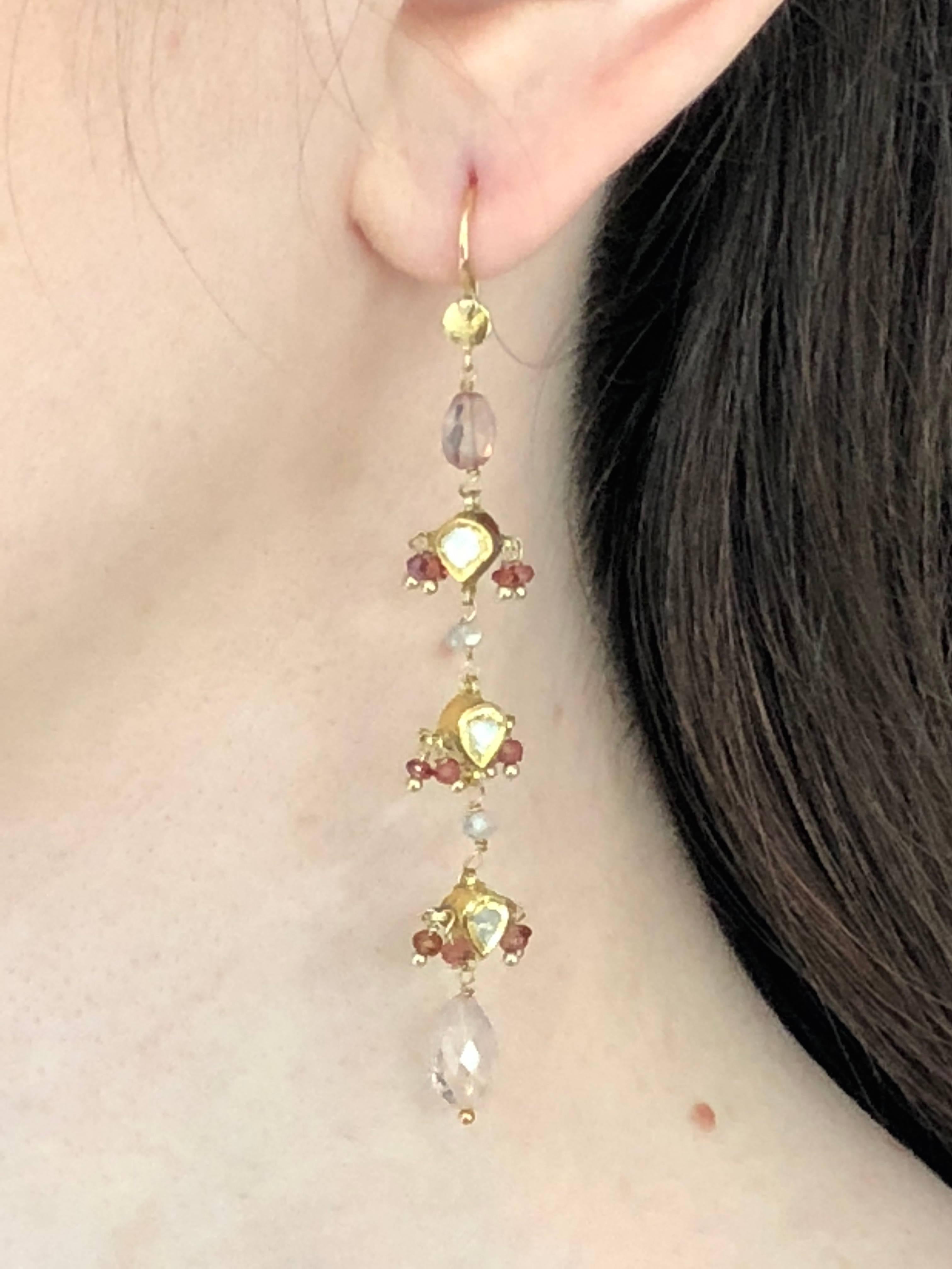 Customized dangling earrings made with vintage 18k gold pendants, enamelled in the back , rose cut diamonds in front, rubies and light pink tourmalines briolette cut, saphires on 14K gold setting. 
Limited edition.

Brand : 5 OCTOBRE
Designer :