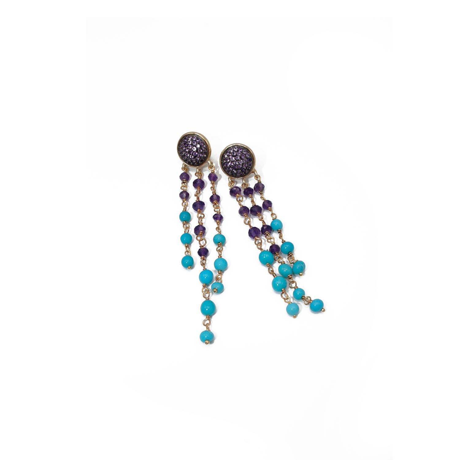 Nice Earrings made up of two paves in Amethyst , small beads in Natural Turquoise and  Amethyst  and Silver.  Pierce and post system. 
925 silver g. 3
Stones ct. 21


