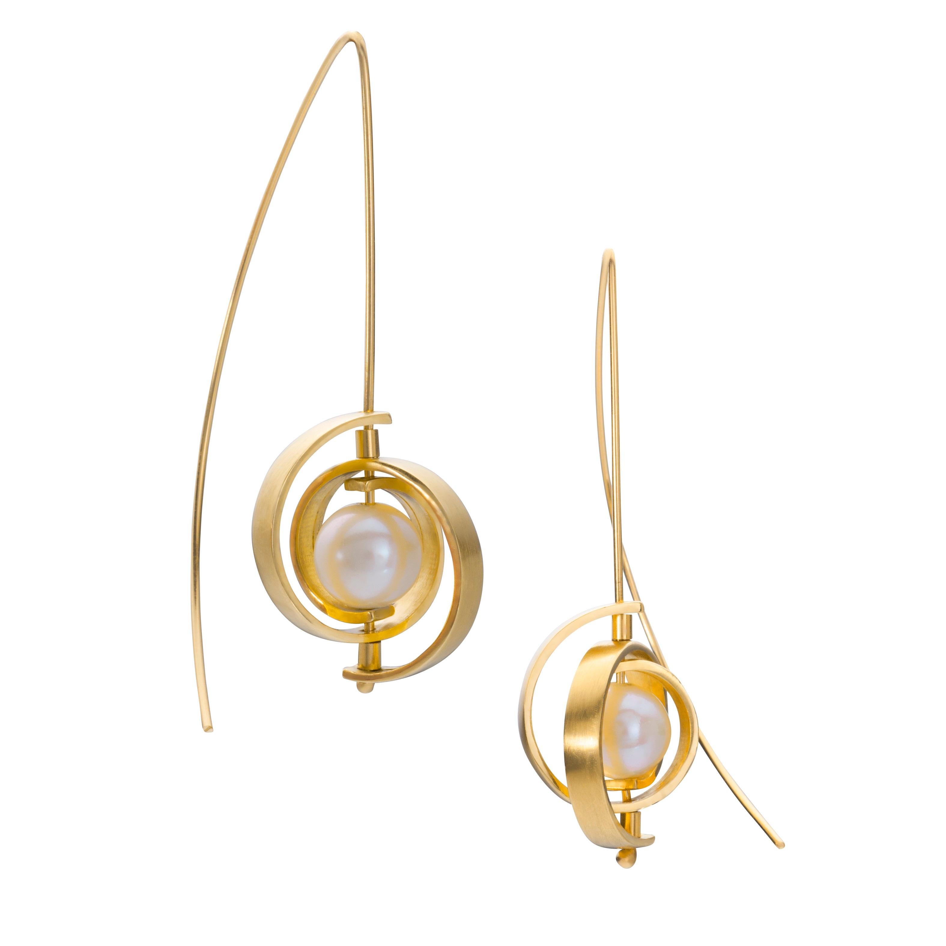 These pearl earrings are the new power pearls - definitely NOT your grandmother's pearls. They are Medium Spiral Dangle Earrings from the Orbit collection in 14k spirals with a 20 gauge ear wire and a lustrous, 7-8.5mm Akoya pearl. The earrings hang