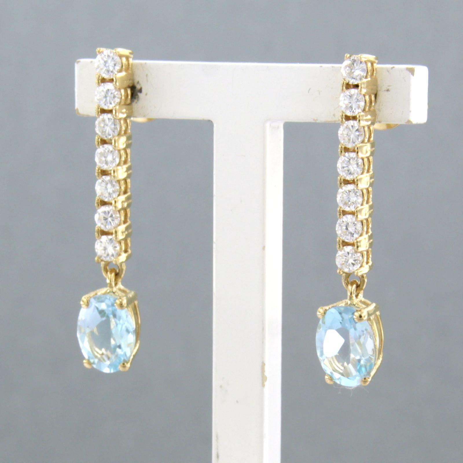 Dangle earrings with blue topaz and brilliant cut diamonds up to 0.58ct 18k gold In New Condition For Sale In The Hague, ZH