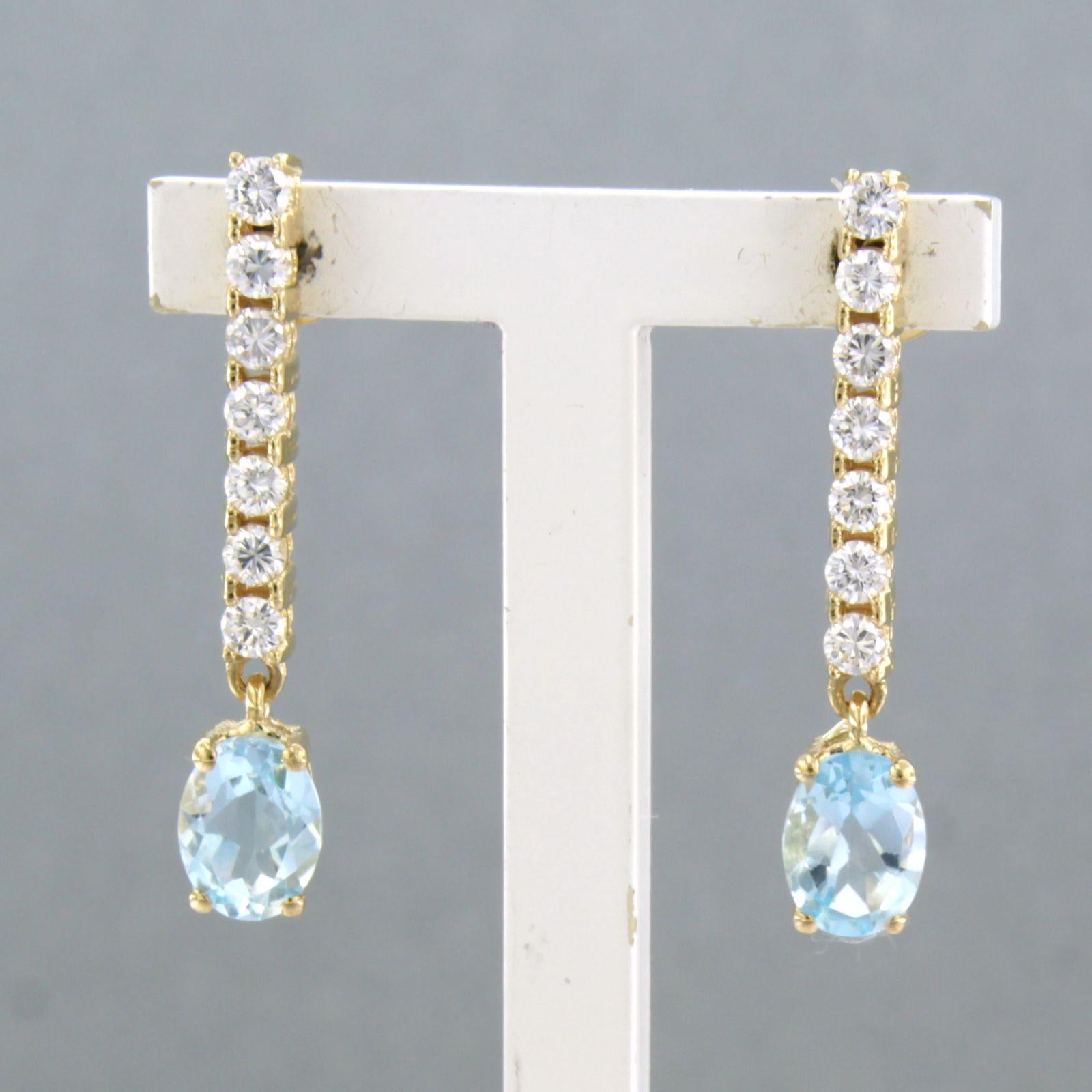 Dangle earrings with blue topaz and brilliant cut diamonds up to 0.58ct 18k gold For Sale 1