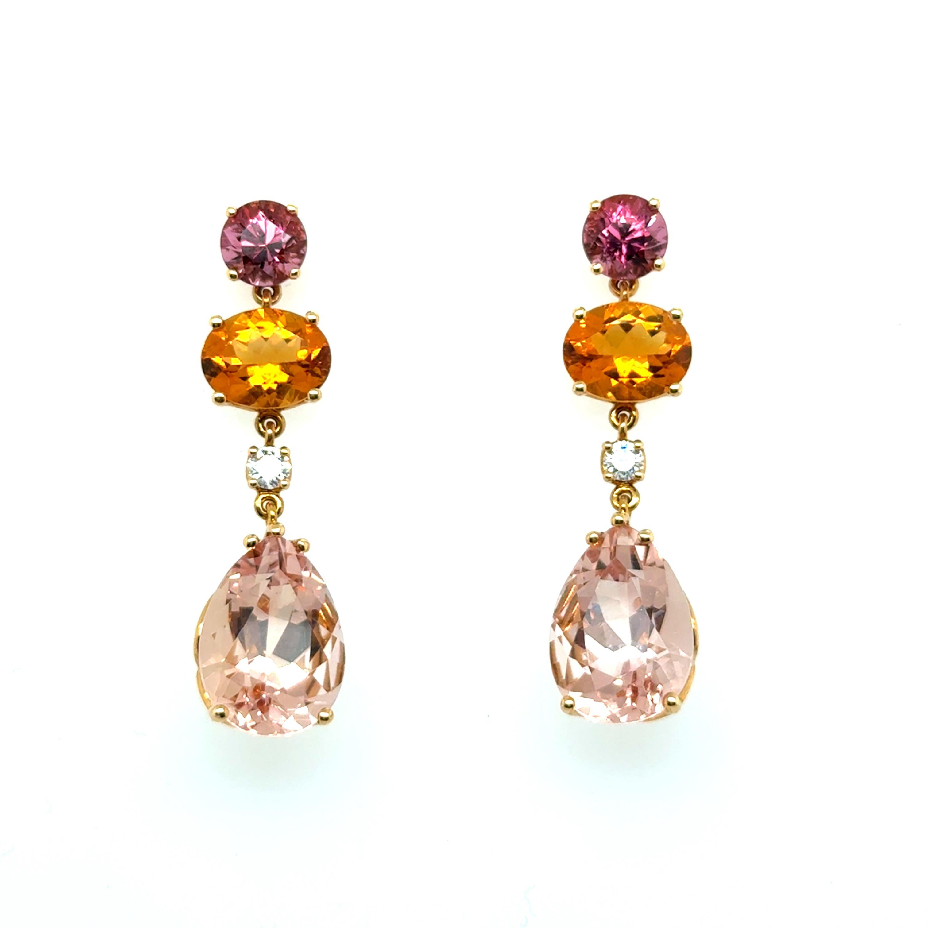 Experience timeless elegance with this Lohri earrings from Switzerland. 

Crafted in 18 Karat red gold, these exquisite earrings feature a stunning selection of gemstones, each enhancing their brilliance. Two pear-cut morganites totaling 12 carats