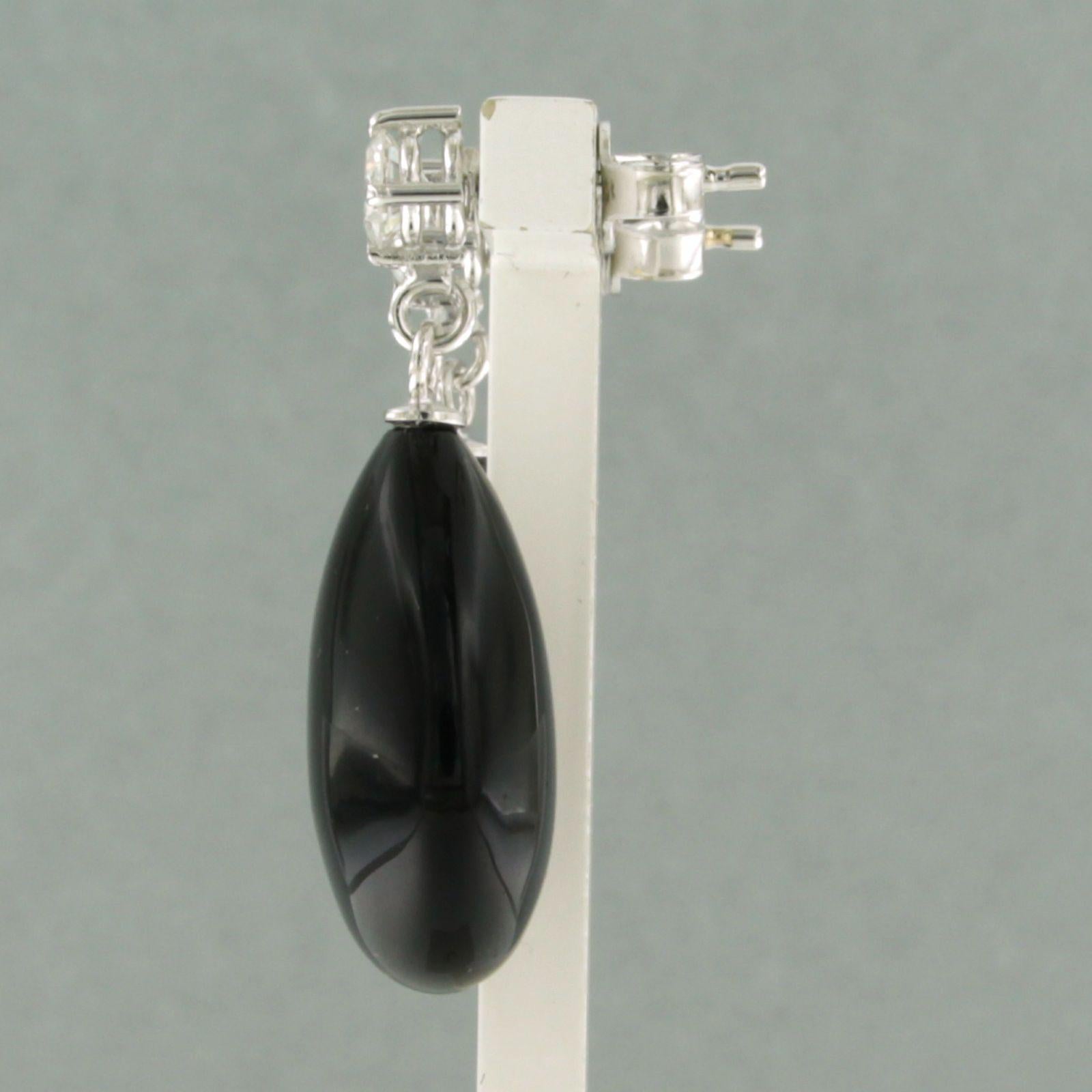 Modern Dangle earrings with onyx and brilliant cut diamond up to 0.56ct 18k gold For Sale