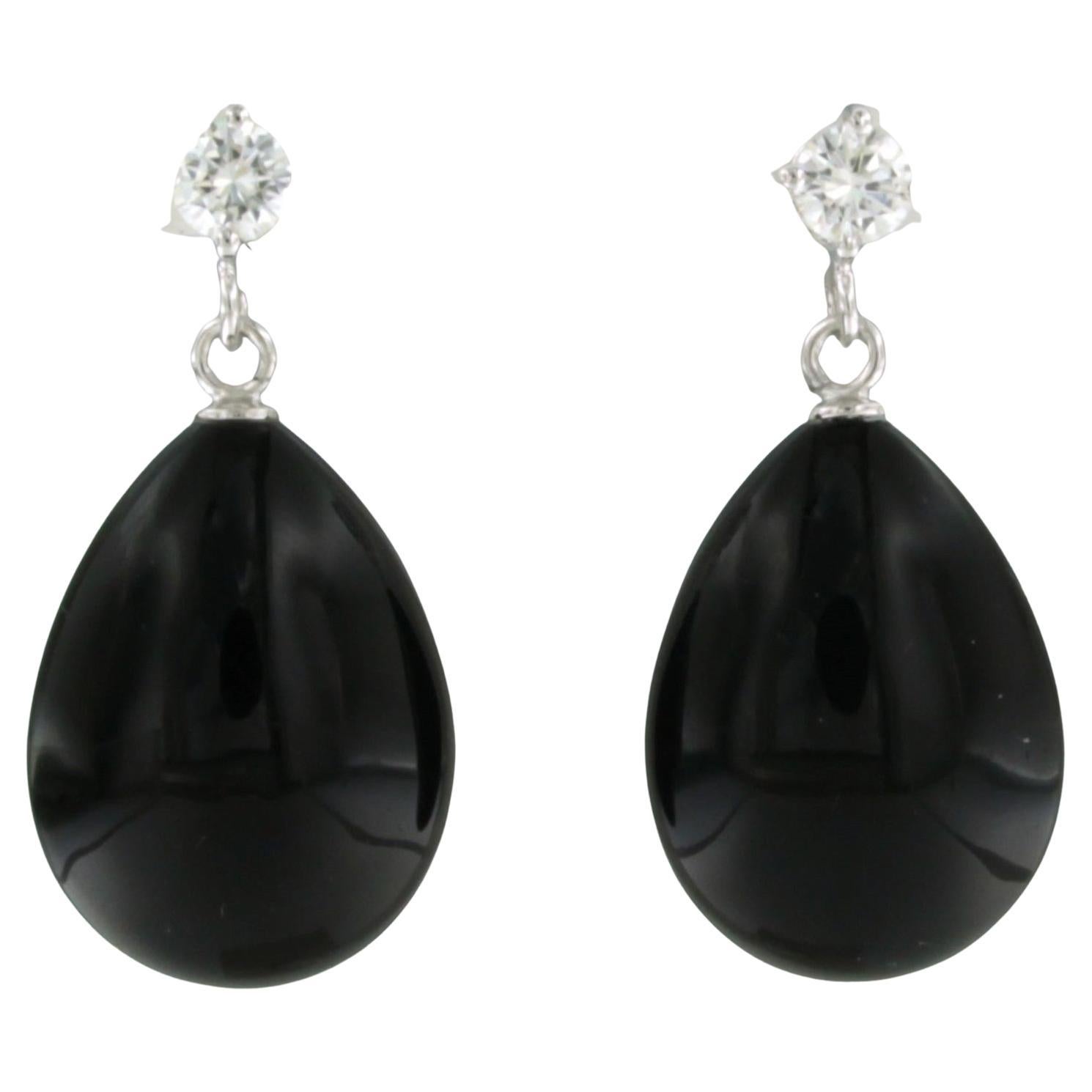 Dangle earrings with onyx and brilliant cut diamond up to 0.56ct 18k gold