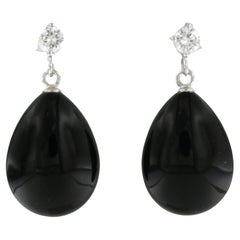 Dangle earrings with onyx and brilliant cut diamond up to 0.56ct 18k gold