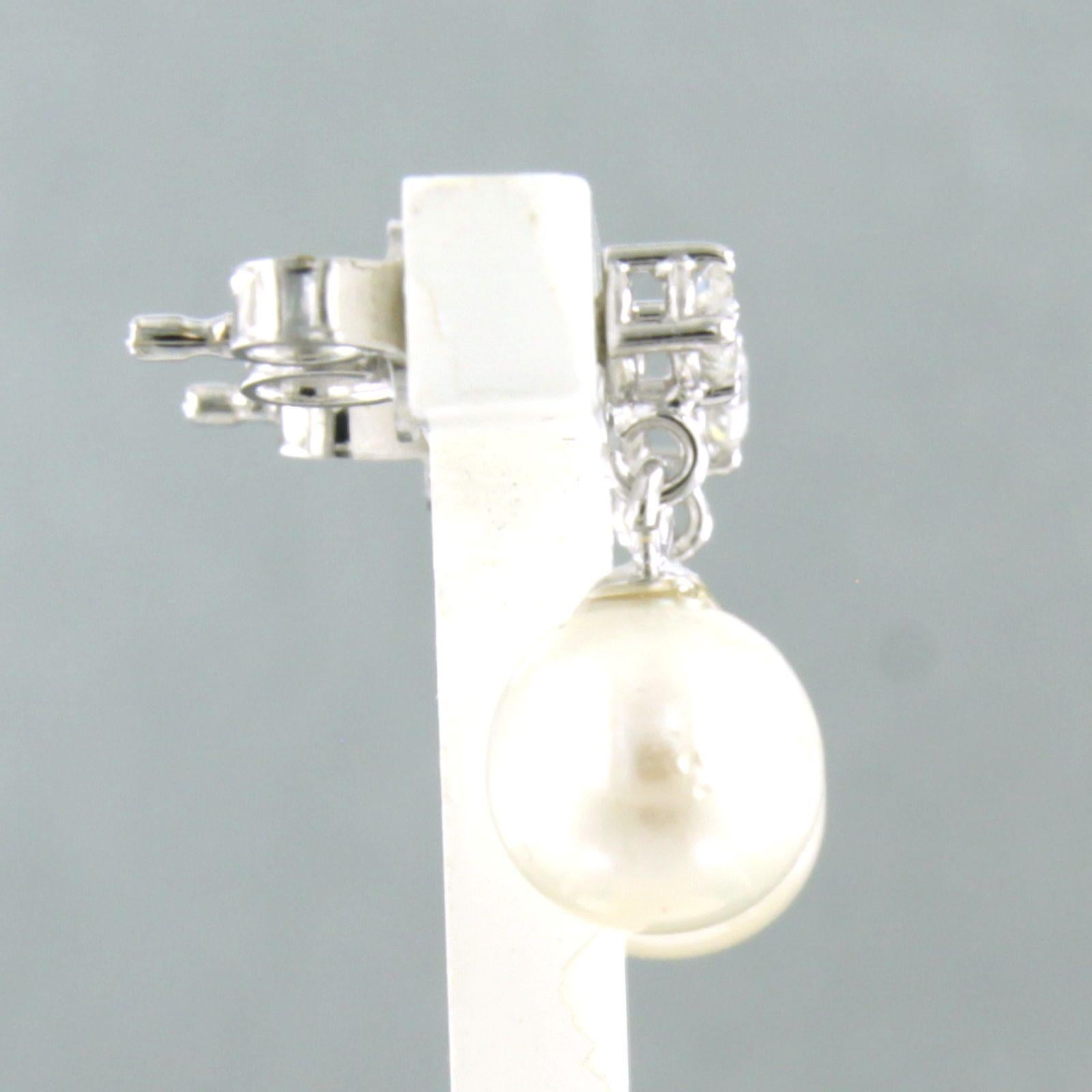 Modern Dangle earrings with pearl and brilliant cut diamonds up to 0.12ct 18k gold For Sale