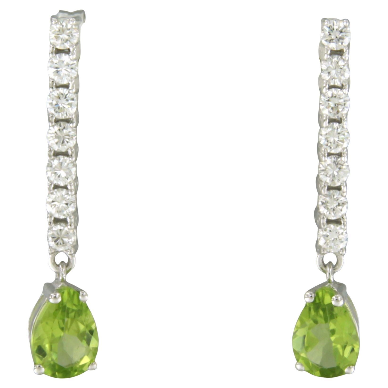 Orecchini pendenti con peridoto e diamanti taglio brillante fino a 0,66ct in oro 18k