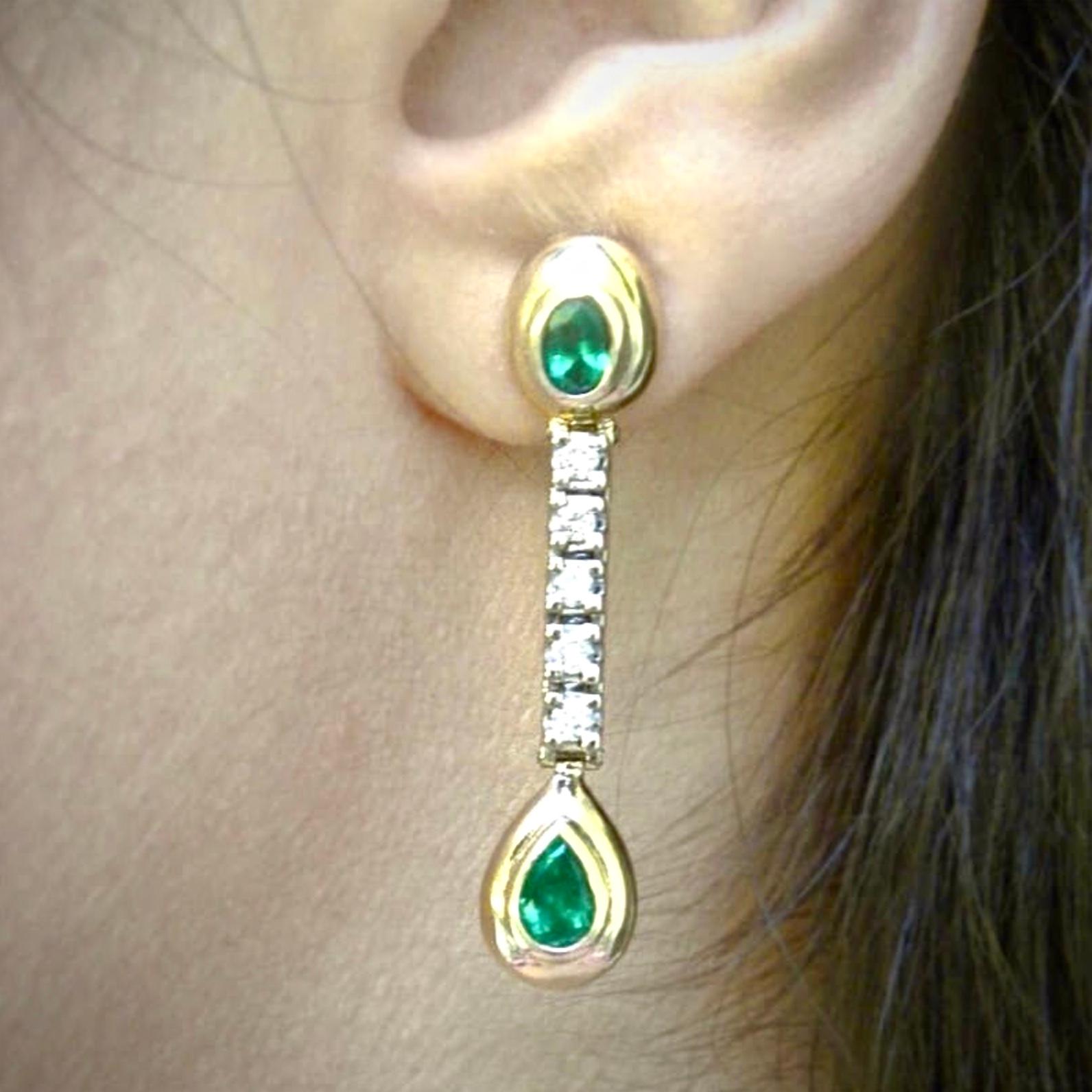 The Gorgeous two-tone gold dangle estate earrings feature 4 (2- Oval/2-Pear shape) natural AAA Colombian emeralds Intense medium green color- VS (very clean ) Excellent color and clarity! The 4 emeralds are bezel set in yellow gold 18K and 10 round