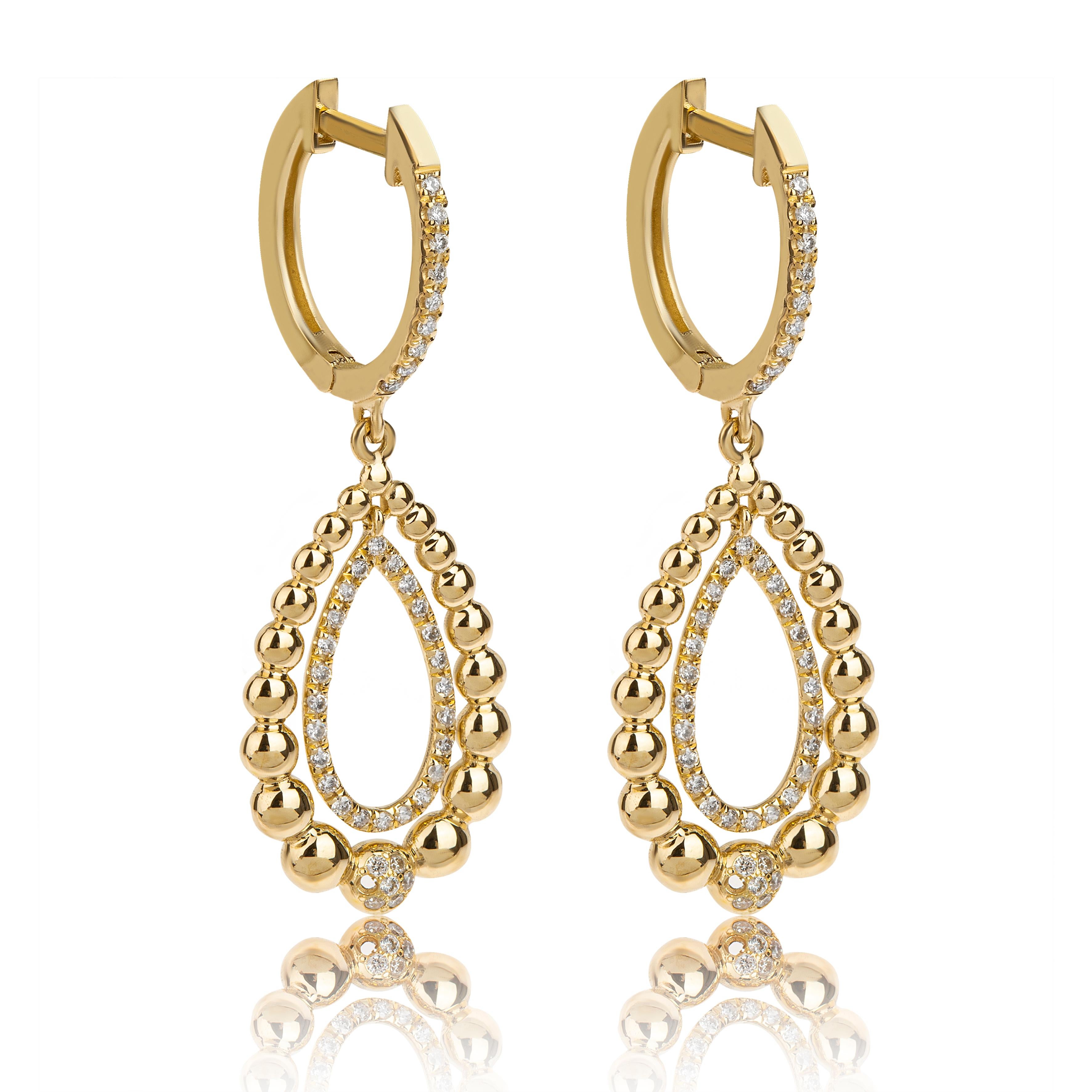 Dangle earrings in pear shape with  brilliant cut Diamonds, handcrafted in 18Kt yellow gold.  The earrings are graduated in two levels. We see also, the traditional technique of granulation. This is a special and mysterious technique that was used