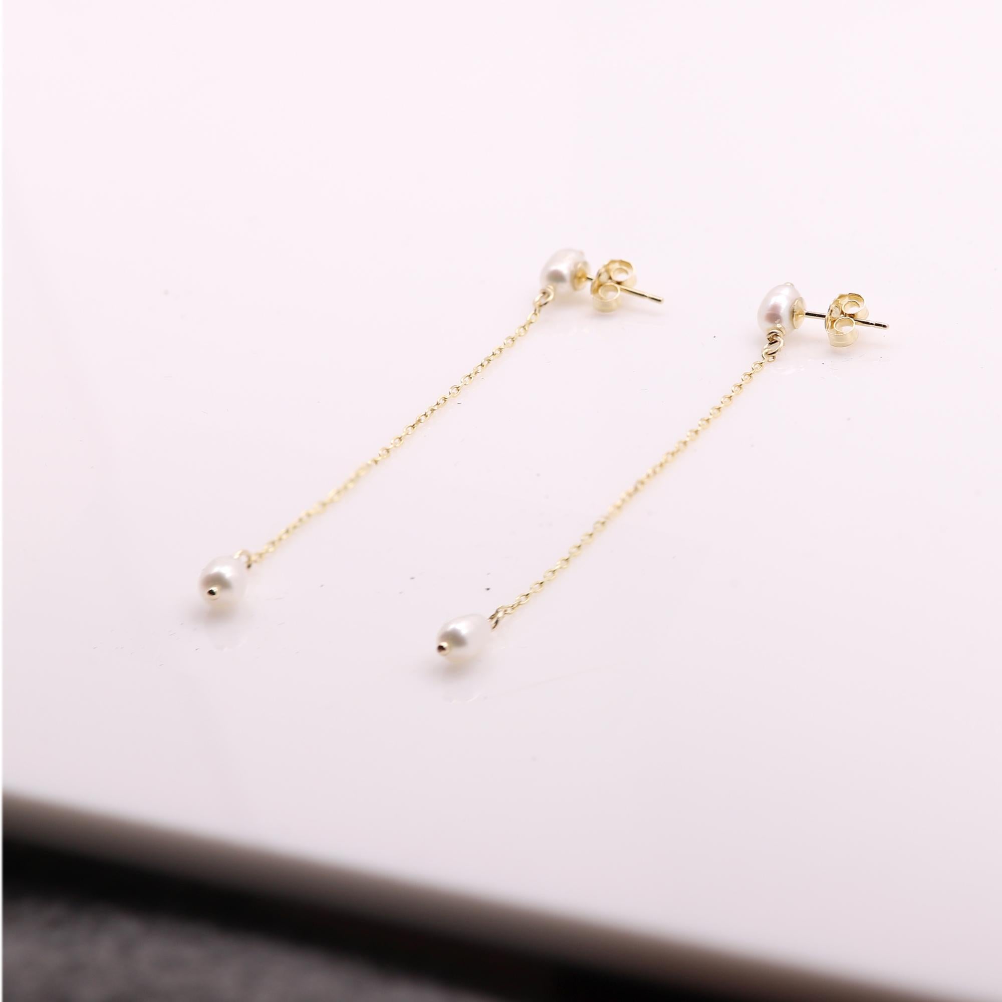 Trendy Elegant dangle earrings 
classic pearls and all 14k  materials
solid 14k yellow gold - all components !
Total weight 6.0 grams 
Length: 2.5' Inch
Butterfly Back
+ Gift Box
Pearl size approx. 6x4 mm
Hand Made in the USA
Chain is a diamond-cut