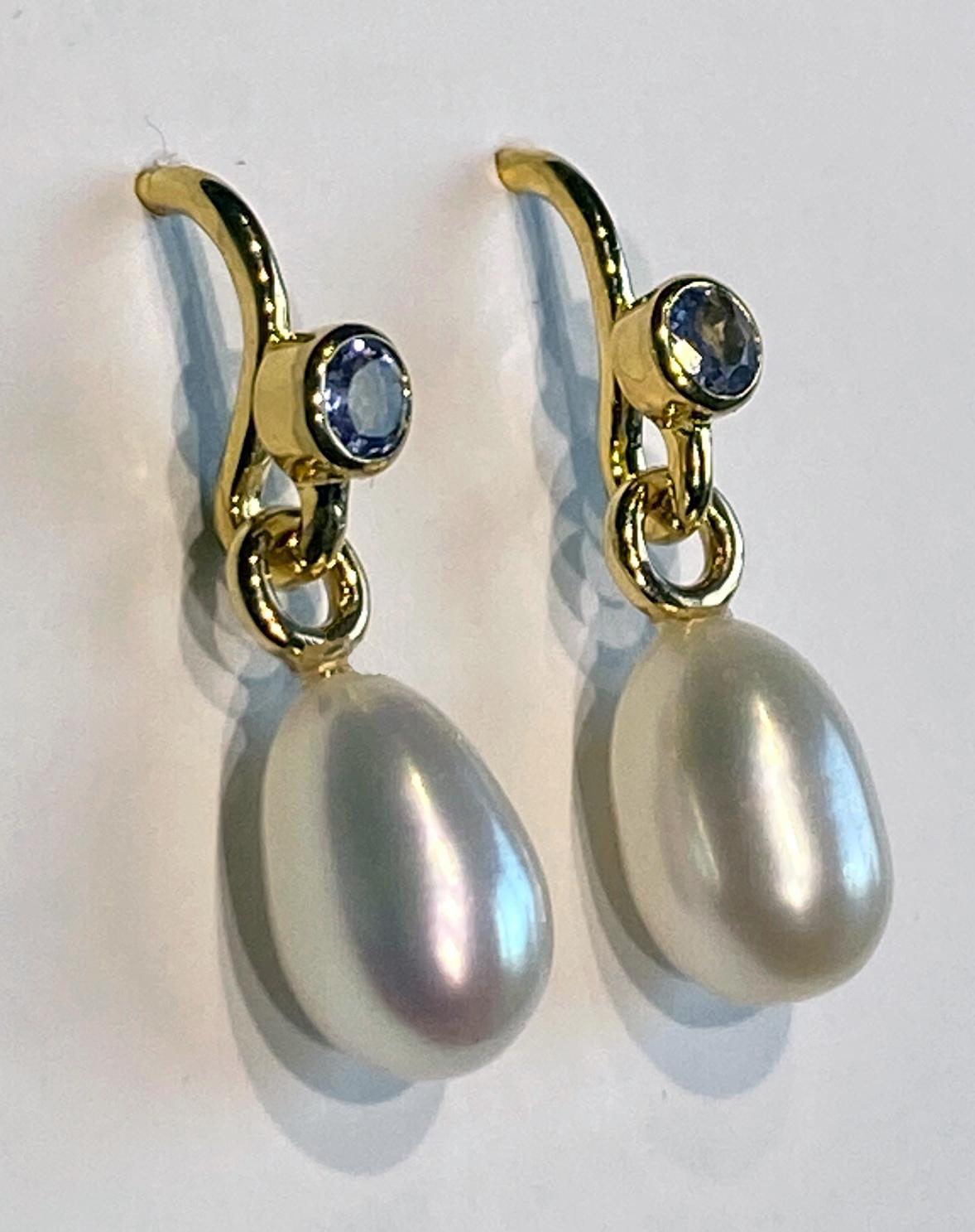 Baroque A Pair of Pearl Dangle Earrings Accented with Tanzanites. For Sale