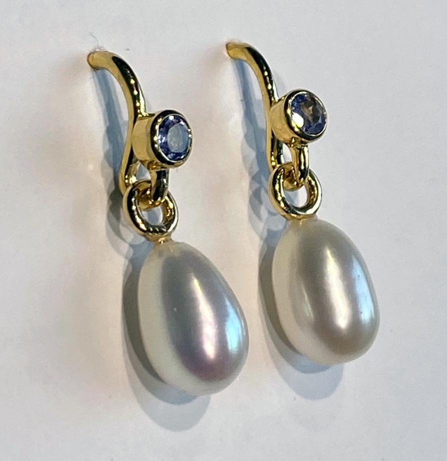 A Pair of Pearl Dangle Earrings Accented with Tanzanites. For Sale 1