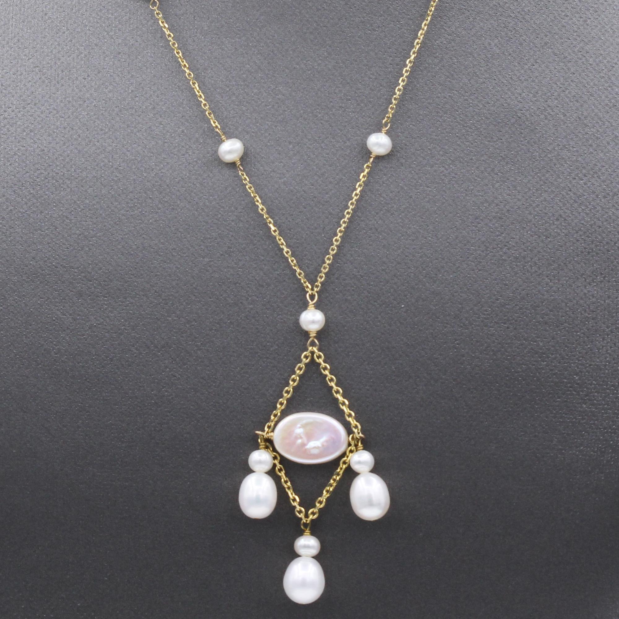 Elegant Pearl Necklace
Dangling wire Style
14k Yellow Gold
Small fresh water Pearls all around approx.  3- 4 mm 
Dangling fresh water Pearls approx. 8 mm
Necklace Length  16.5’ Inch
Dangle Length approx. 2’ inch
Spring Ring Lock
Total weight 5.20