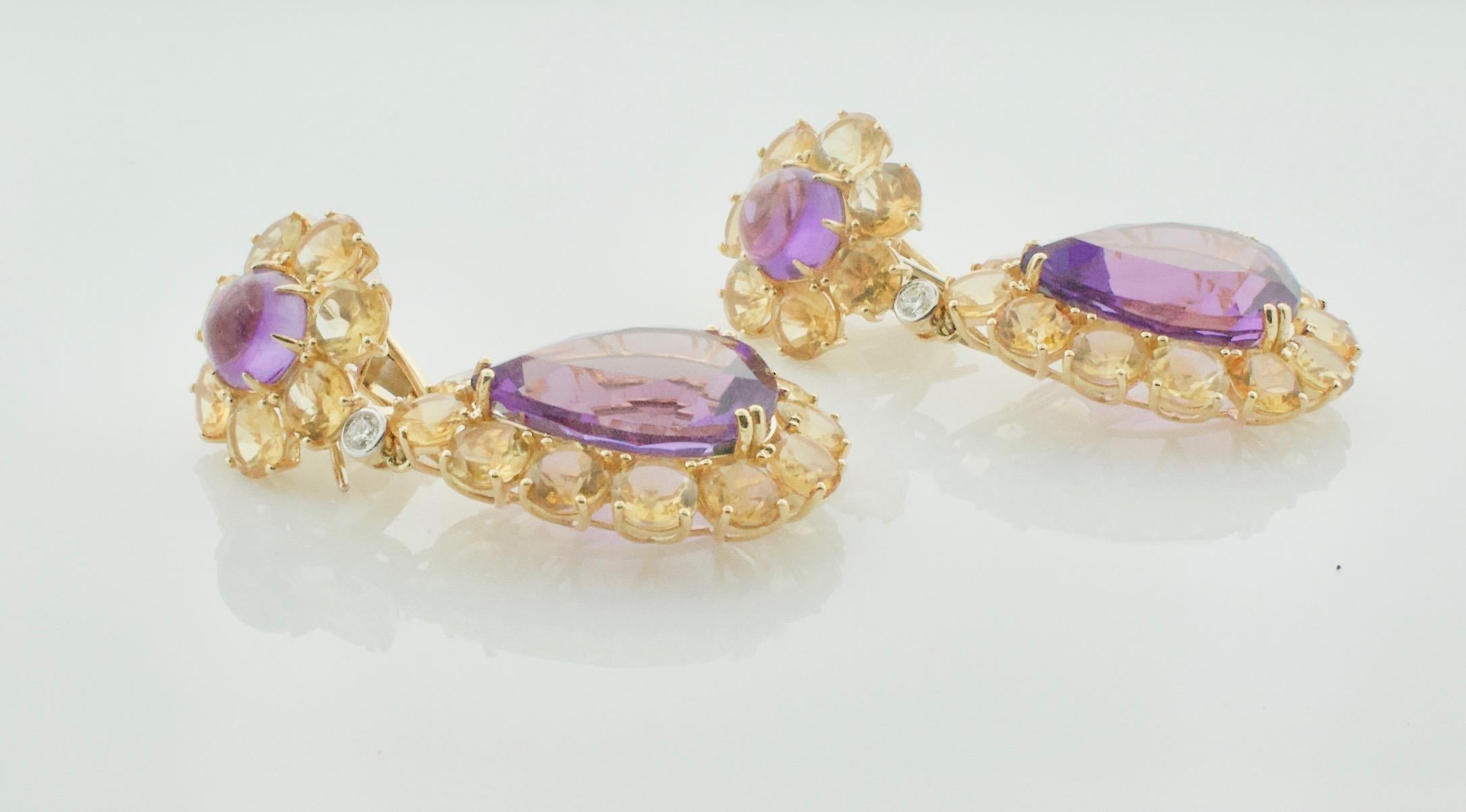 Dangling Amethyst, Citrine and Diamond Show Stopper Large Earrings in 18k
Beautifully Constructed 
2 Pear Shape Amethysts Weighing 30.00 Carats Approximately 
2 Cabochon Amethysts Weighing 7.00 Carats Approximately 
38 Round Cut Citrines Weighing
