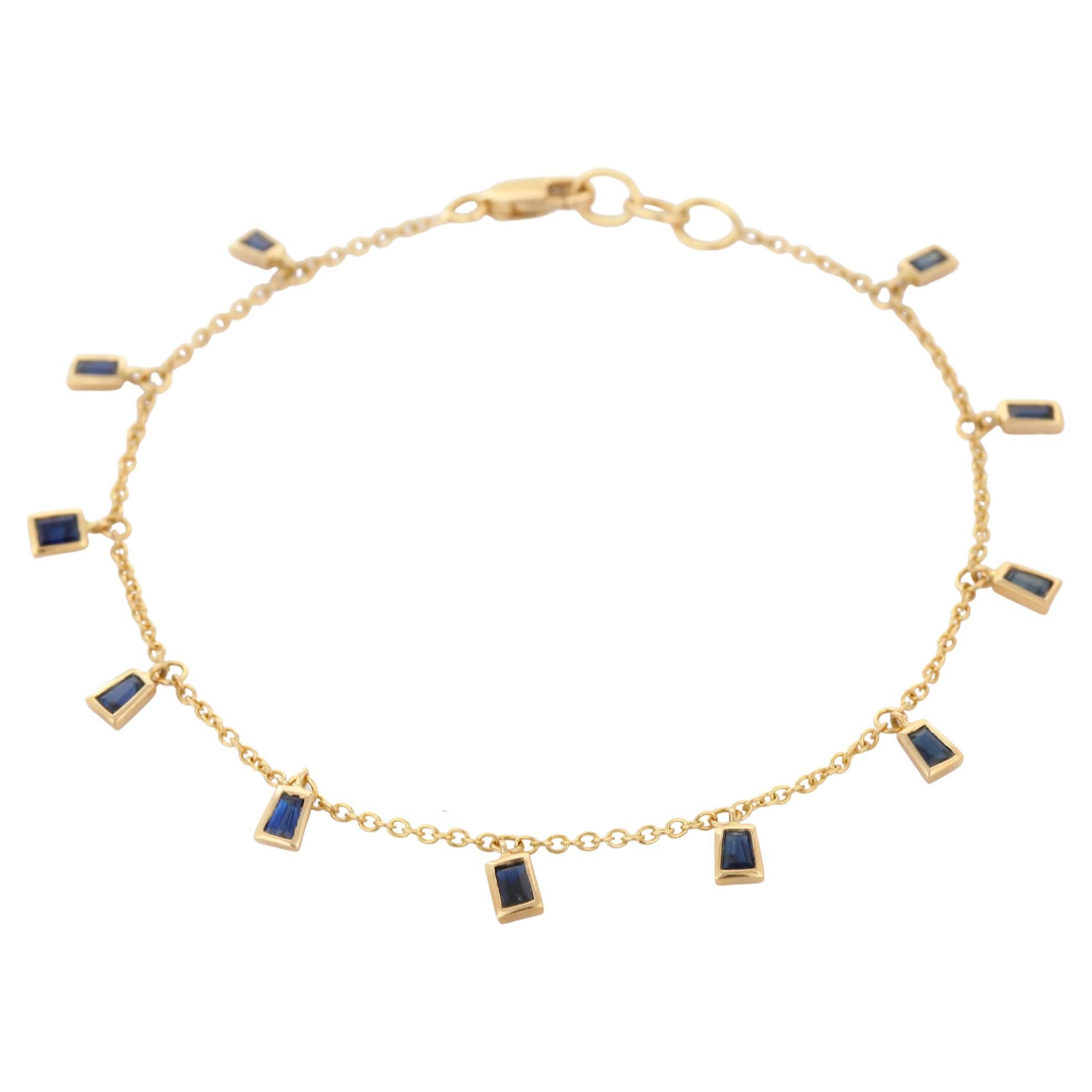 Dangling Blue Sapphire Charm Chain Bracelet Mounted in 18K Yellow Gold For Sale