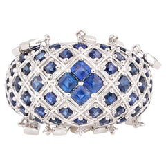 Anello penzolante con zaffiro blu e diamante in oro bianco 18 carati