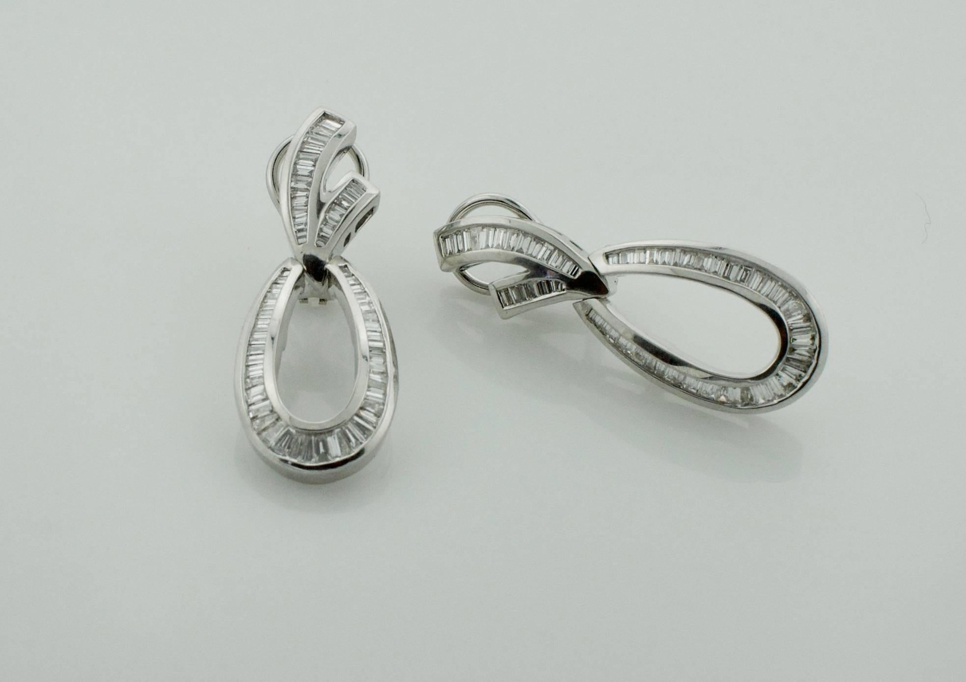Dangling Diamond Baguette Earrings in White Gold 2.50 carats
One Hundred and Eighteen Round Brilliant Cut Diamonds weighing 2.50 carats approximately [GH VS-S!1]
The Bottom is Hinged and Swings!

