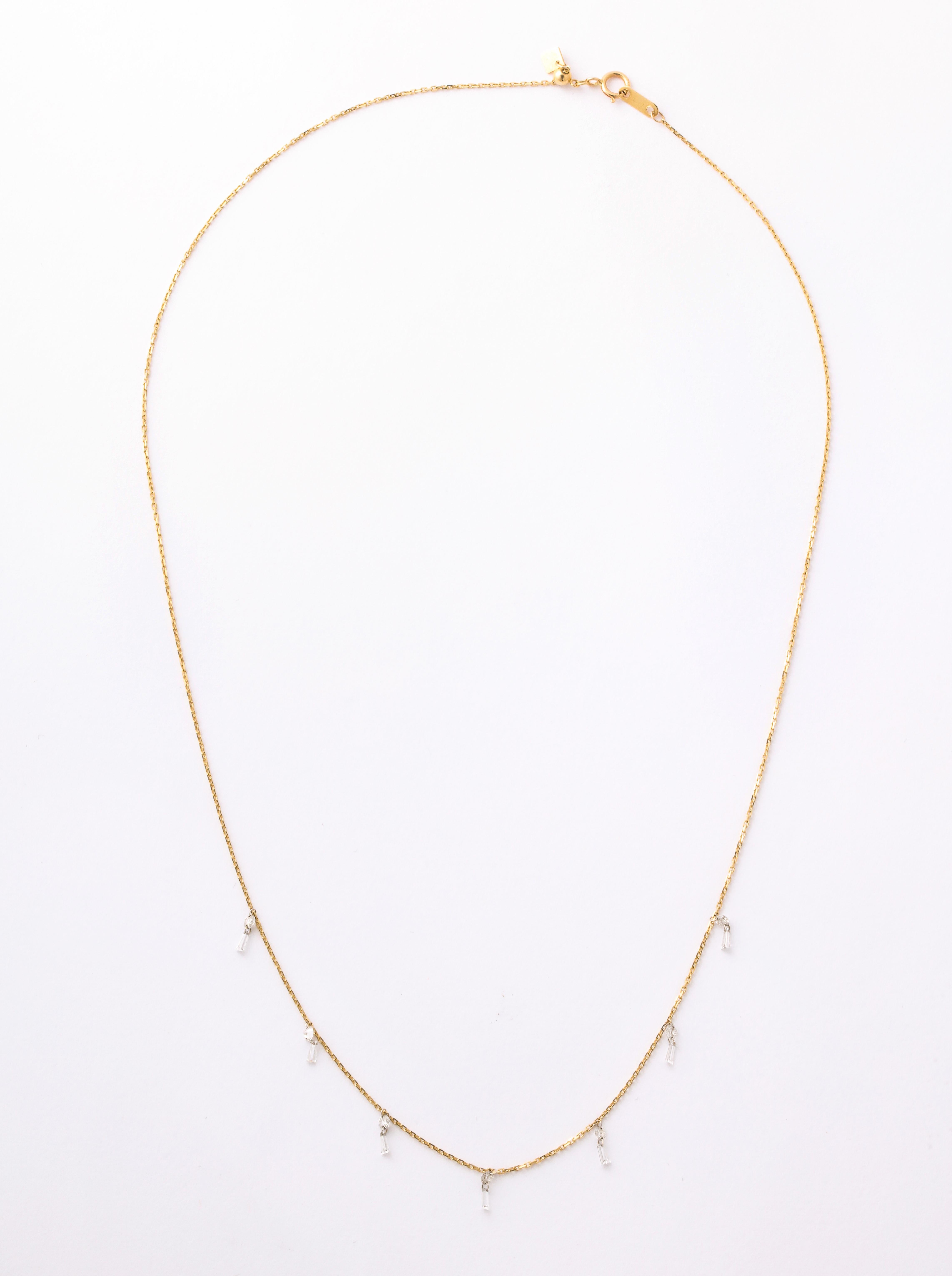   This is a special necklace with a total of 1 ct Dangling  Baguette Diamonds which are 
  drillled and  suspended on an 18K fine gold chain, making it easily  wearable all the time 
 alone or with other necklaces.  This is so comfortable you never