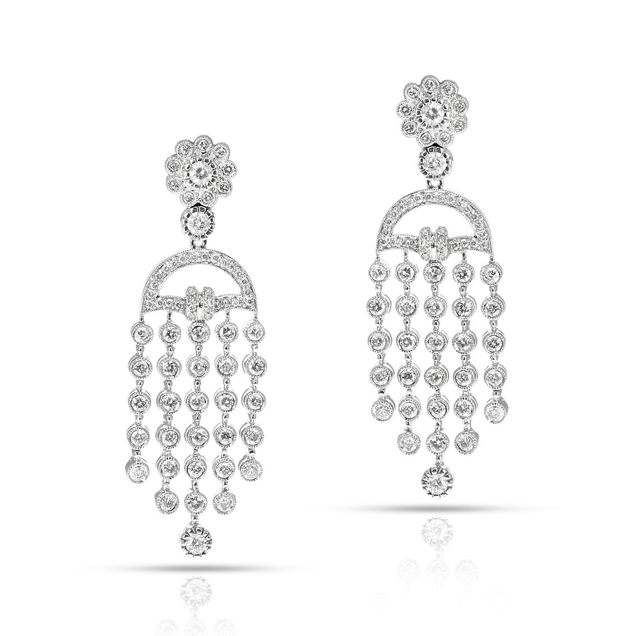 A pair of Diamond Dangling Earrings in 14K White Gold. The diamonds weigh appx. 2 carats. The length is 2 inches. The total weight of the diamonds is 13.90 grams.