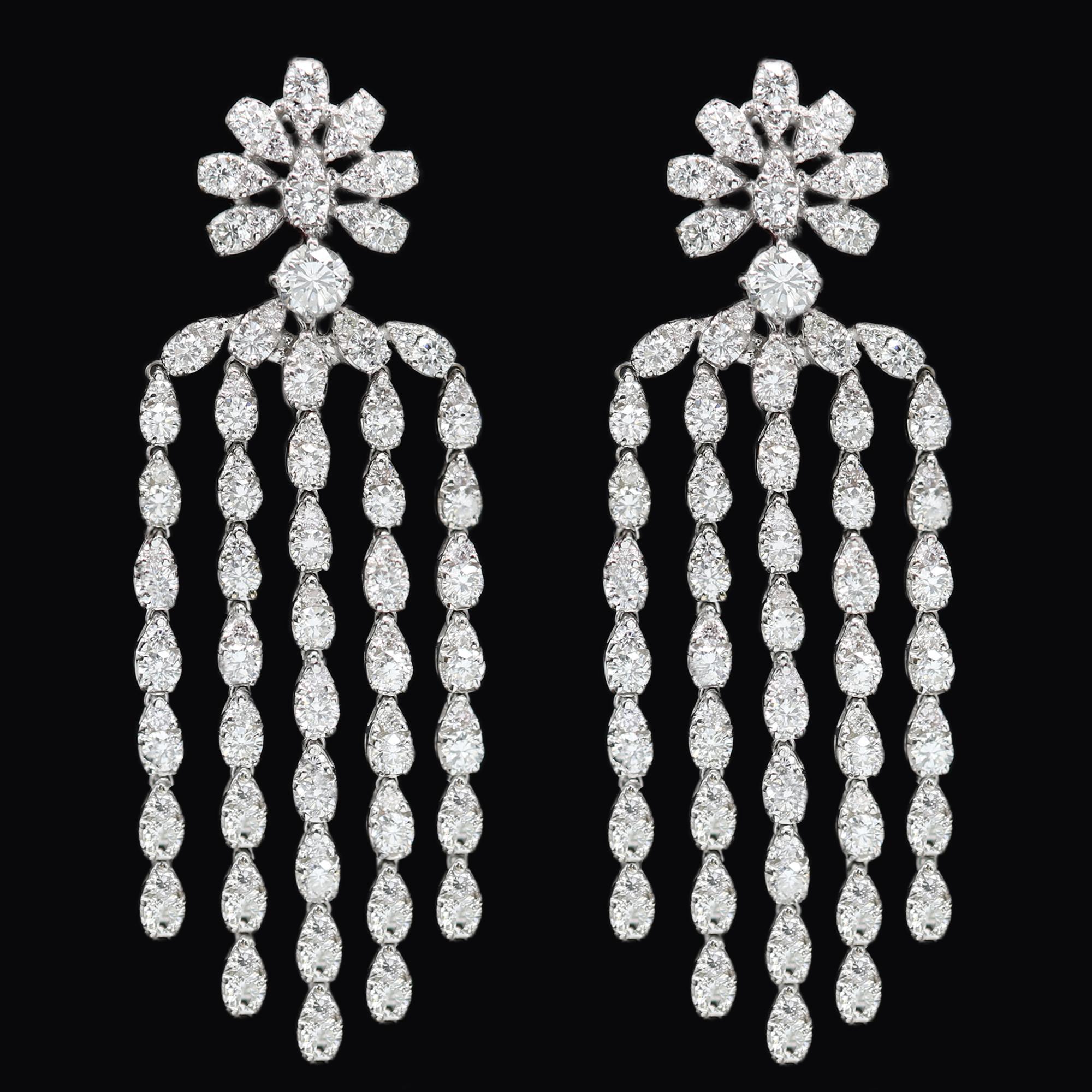 Very Impressive Sparkling Dangling Earrings
A Real Chandelier Style
All Natural Brilliant Diamonds !
Total Diamonds 6.37 carat G-VS-SI.
Made of round diamonds set into pear shape settings
18k White Gold 18.50 grams
Omega type back closure.
Overall