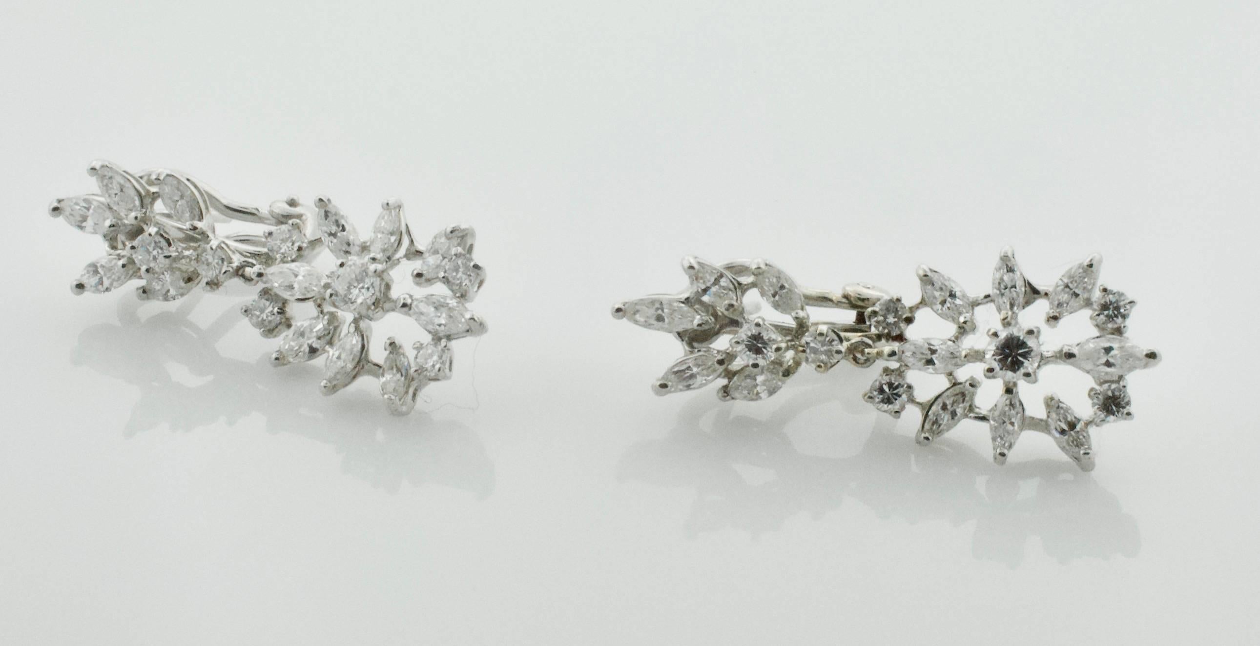 Dangling Diamond Earrings 2.90 carats Circa 1950's
Introducing our exquisite Dangling Diamond Earrings from the 1950s, boasting a total carat weight of 2.90. These earrings feature a timeless design, perfect for adding a touch of elegance to any
