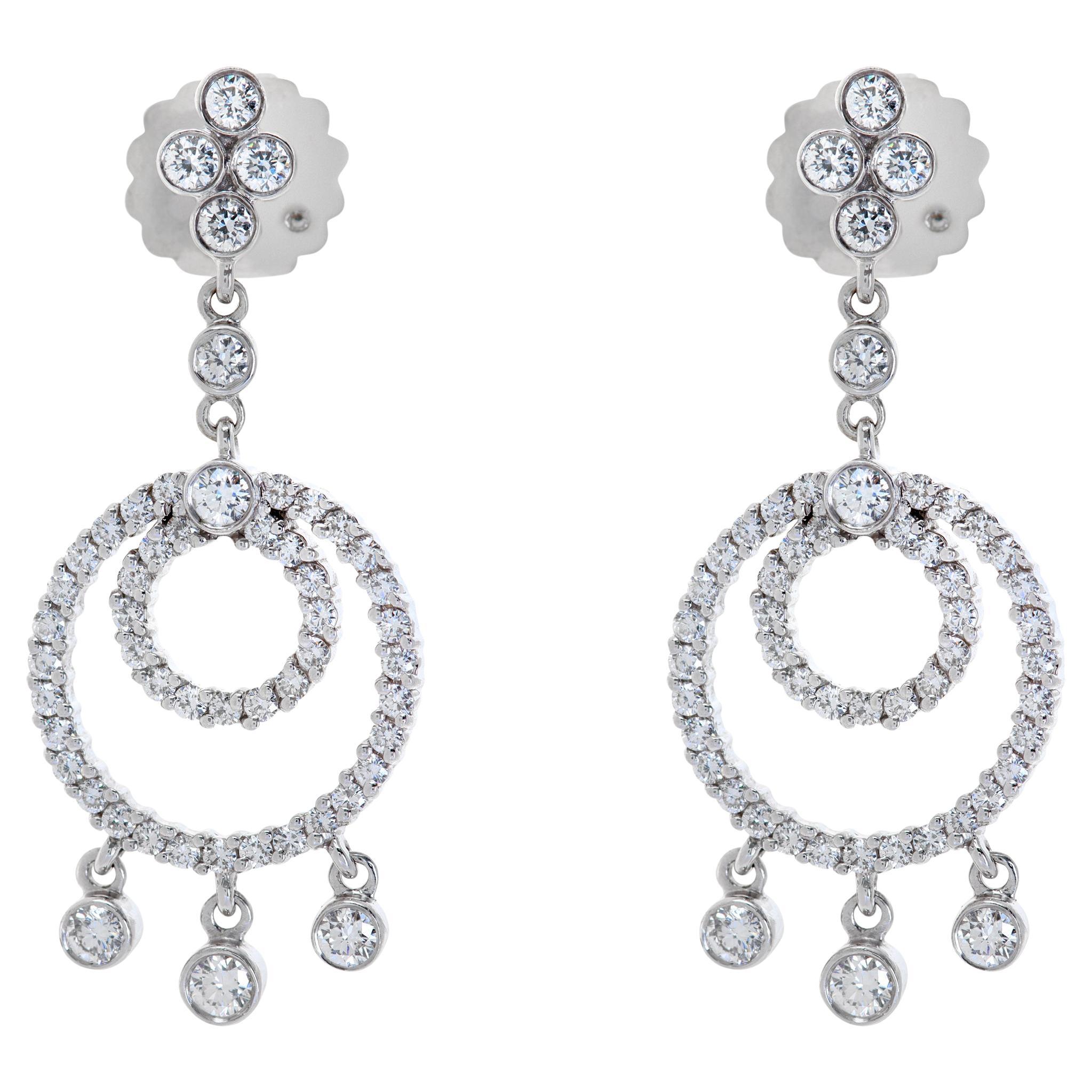 Dangling diamond earrings in 18k gold w/ round diamonds (G-H color, SI clarity)