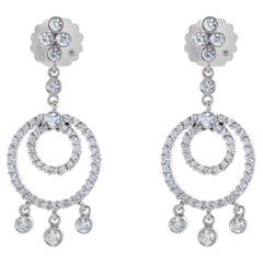 Dangling diamond earrings in 18k gold w/ round diamonds (G-H color, SI clarity)