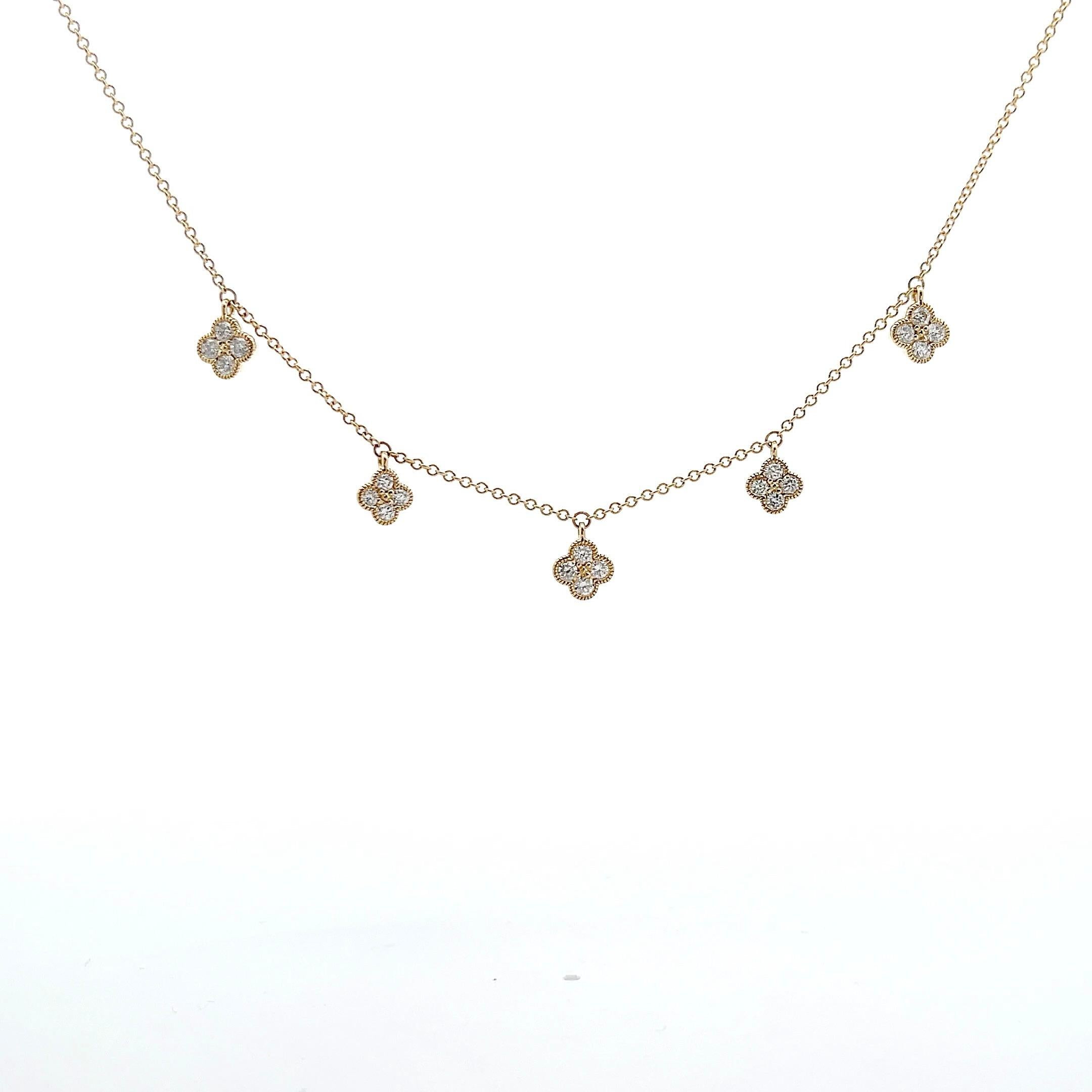 Diamond flower 5 station necklace set with 20 round brilliant cut diamonds weighing 0.78 carats in 18K yellow gold. Necklace is 18