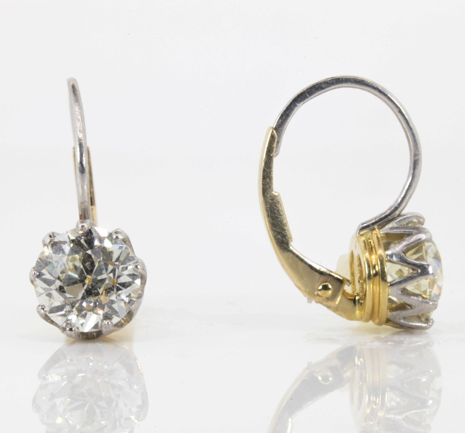 Women's Dangling Diamond Platinum Gold Earrings