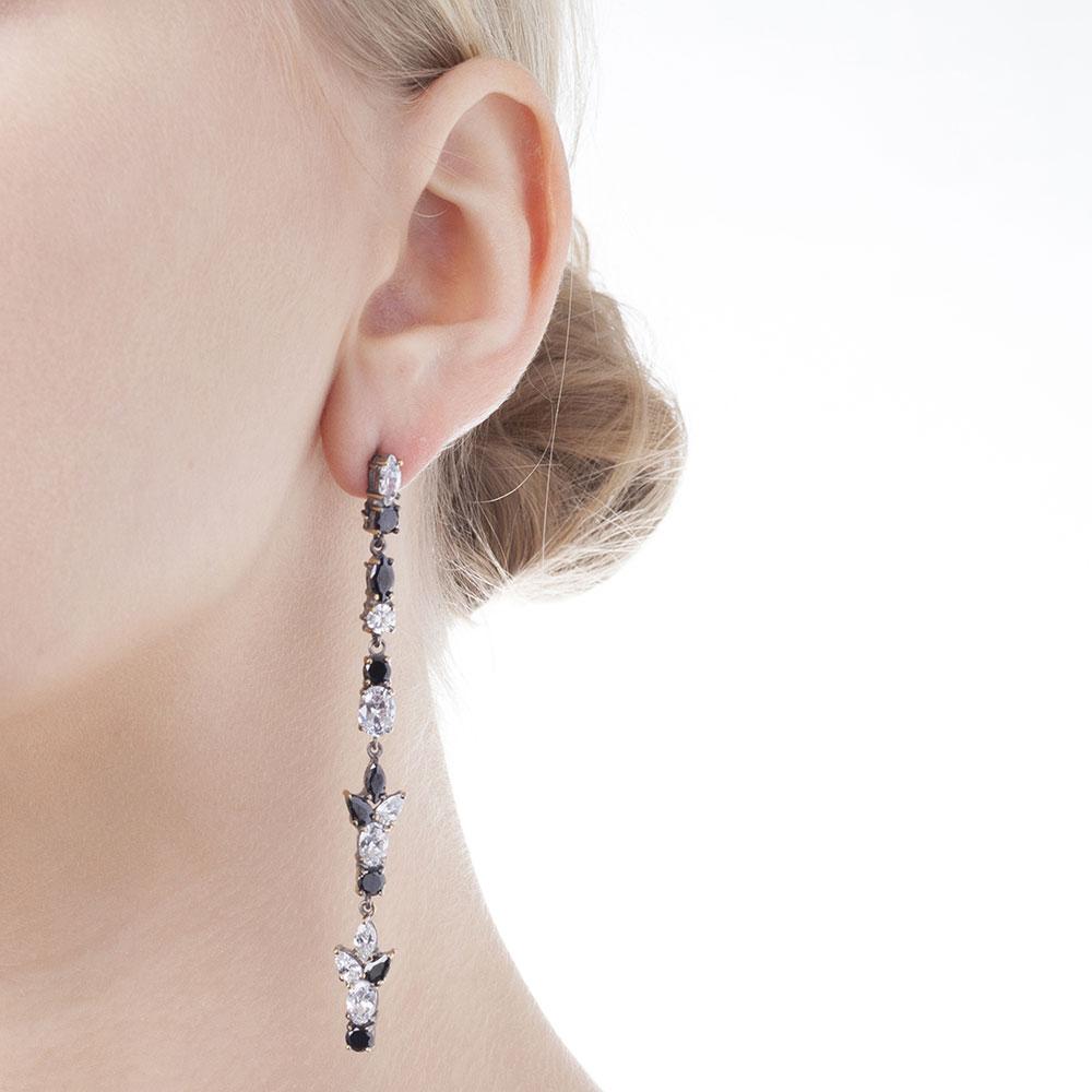 Iosselliani's tribute to the early 80's love for optical! Black and white cubic zirconia in a specular setting for a stunning pair of chandelier earrings. Crafted for pierces ear lobes, the earrings will add extra grandeur to your gown. 8 cm lenght,