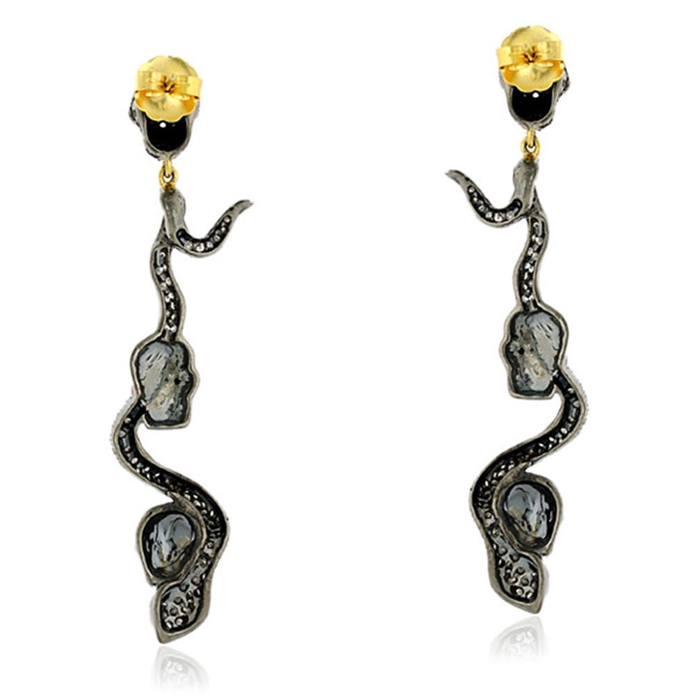 Modernist Dangling Snake and Skull Diamond Earring in Silver and Gold For Sale