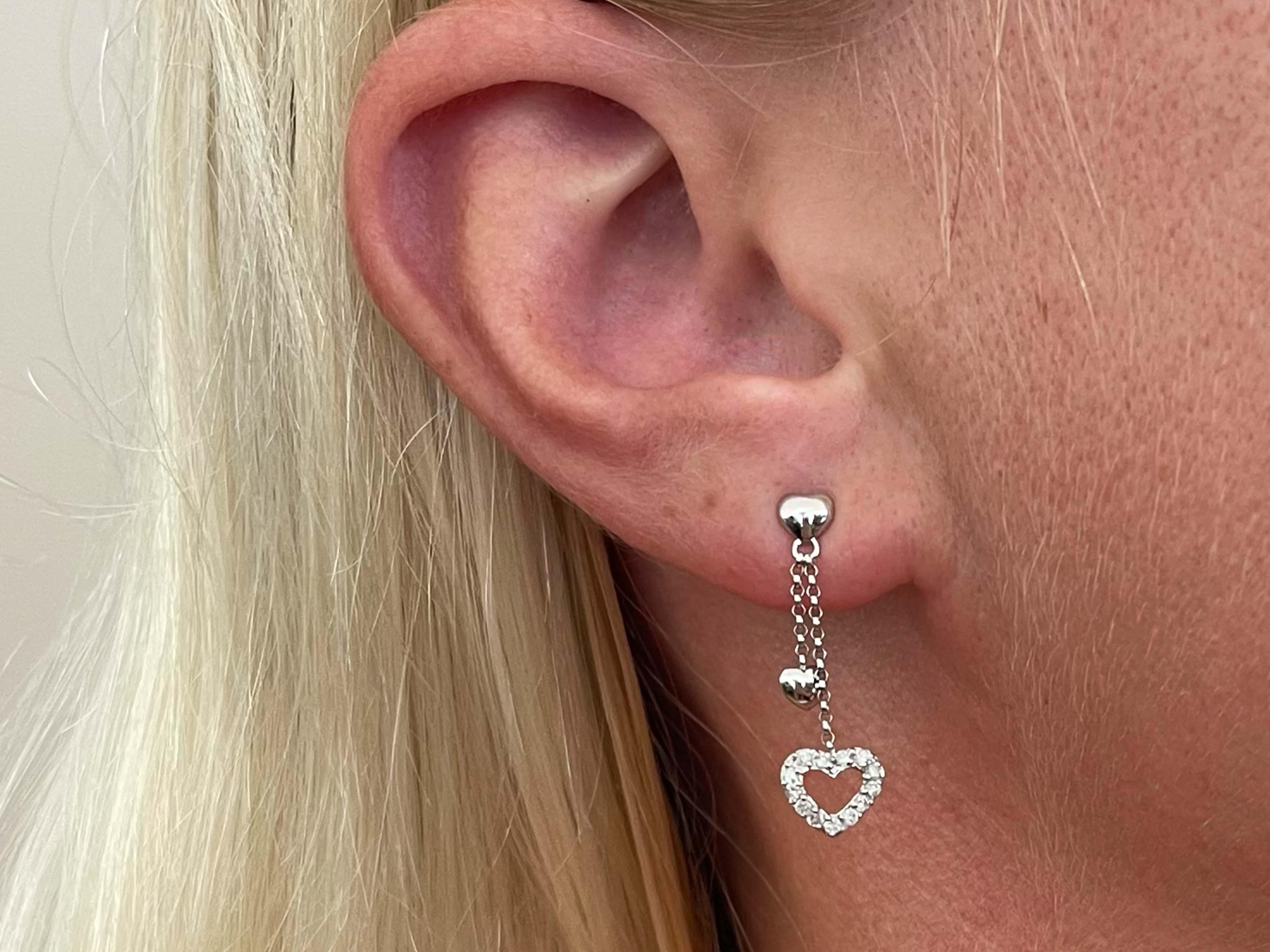 Earrings Specifications:

Metal: earrings are 18K White Gold and backs are 14K white gold
Total Weight: 1.6 Grams

Diamond Count: 26

Diamond Carat Weight: ~0.20 carats

Stamped: 