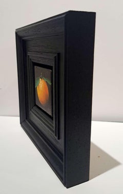 Diptych of Pocket Yellowy Orange Clementine and Very Shiny Very Red Apple