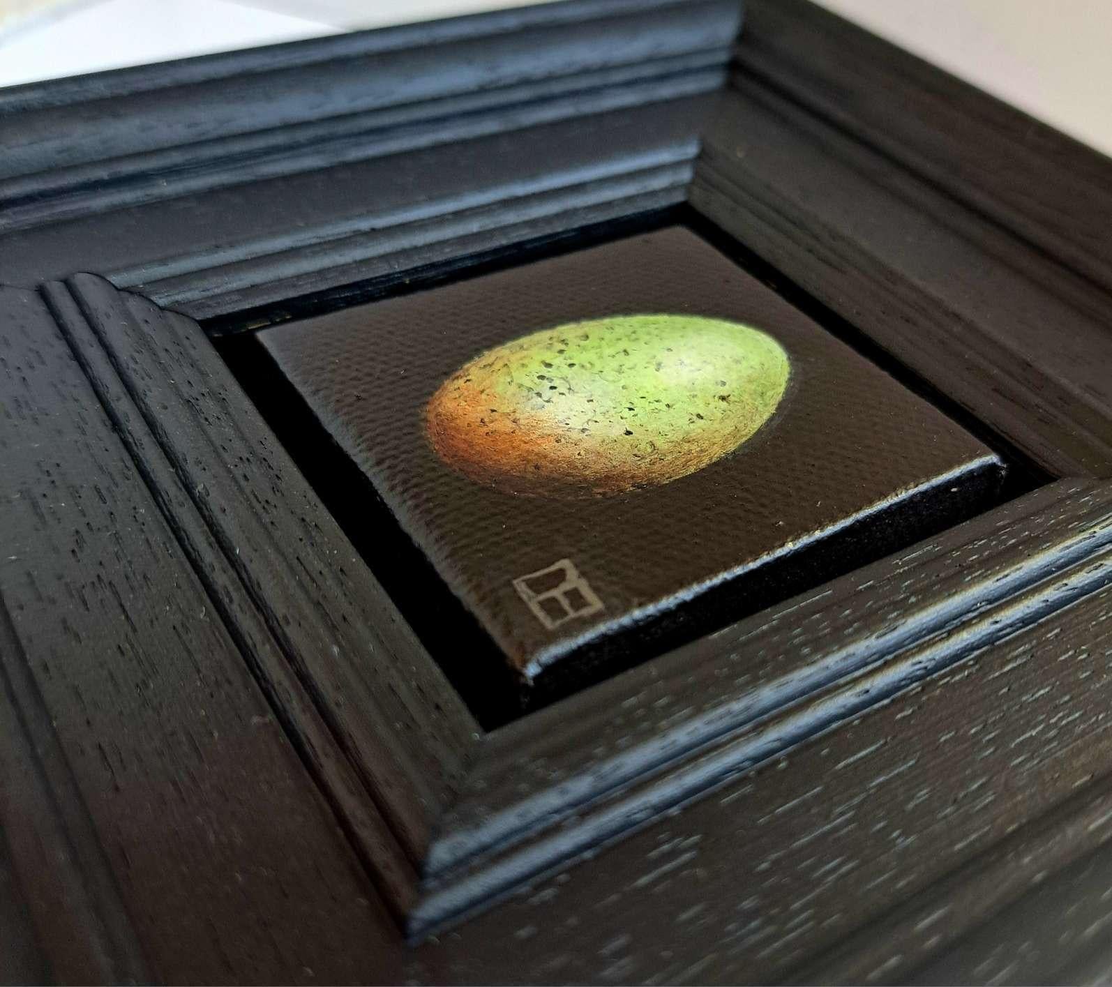 Pocket Yellow Greenish Blackbird's Egg 3c is an original oil painting by Dani Humberstone as part of her Pocket painting series featuring small scale realistic oil paintings, with a nod to baroque still life painting. The paintings are set in a
