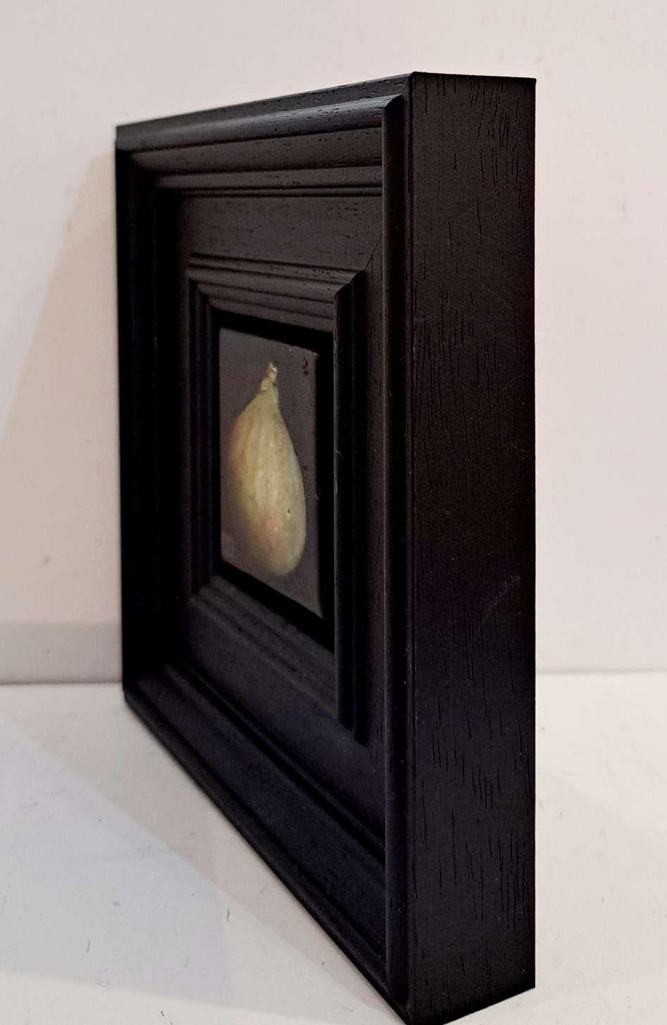 Pocket Green Fig 2c is an original oil painting by Dani Humberstone as part of her Pocket Painting series featuring small scale realistic oil paintings, with a nod to baroque still life painting. The paintings are set in a black wood layered