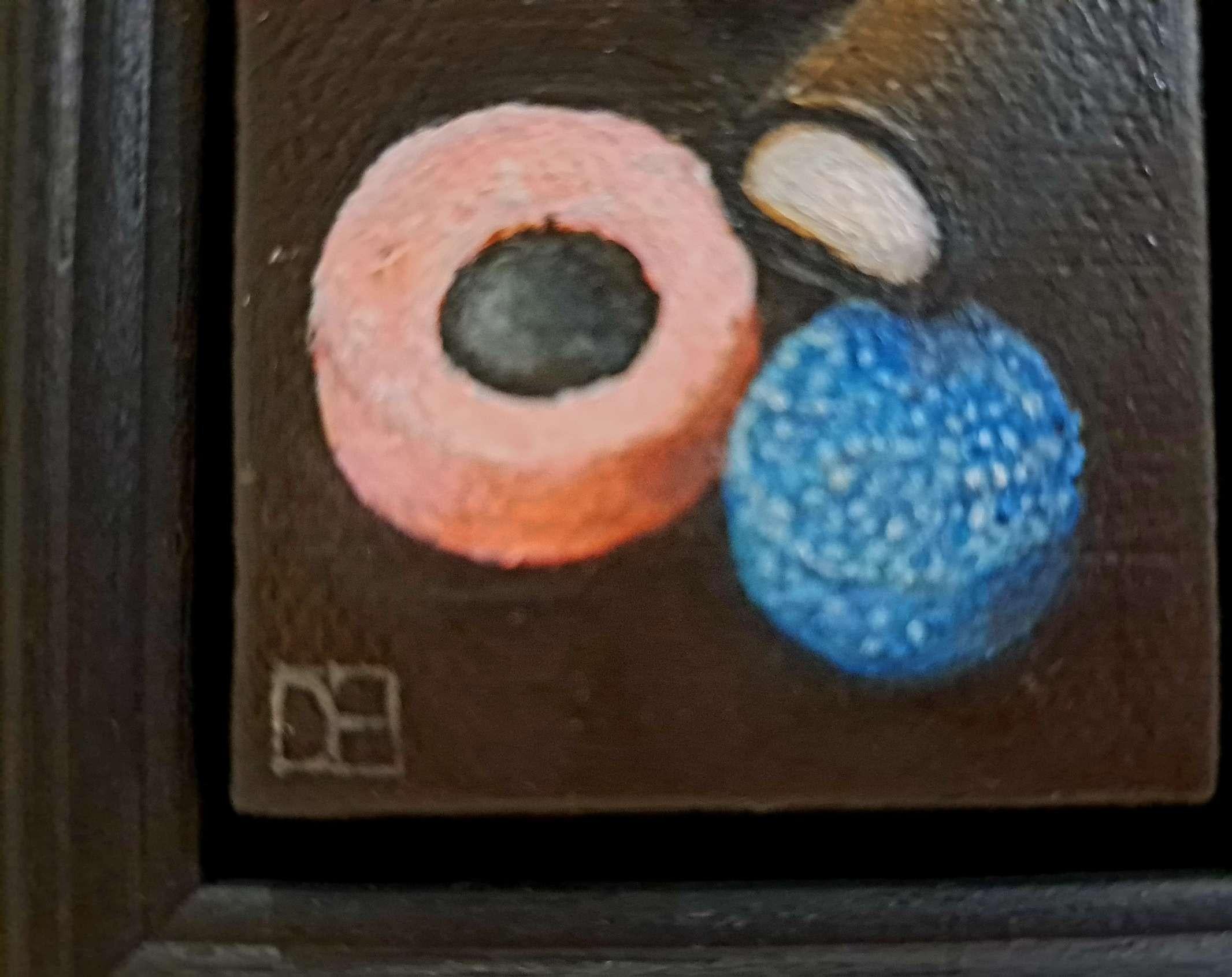 Pocket Licorice Allsorts is an original oil painting by Dani Humberstone as part of her Pocket Painting series featuring small scale realistic oil paintings, with a nod to baroque still life painting. The paintings are set in a black wood layered