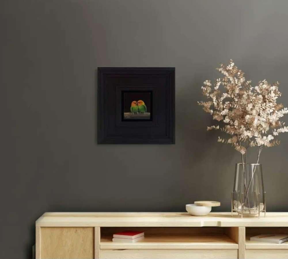 Pocket Lovebirds 8c is an original oil painting by Dani Humberstone as part of her Pocket painting series featuring small scale realistic oil paintings, with a nod to baroque still life painting. The paintings are set in a black wood layered