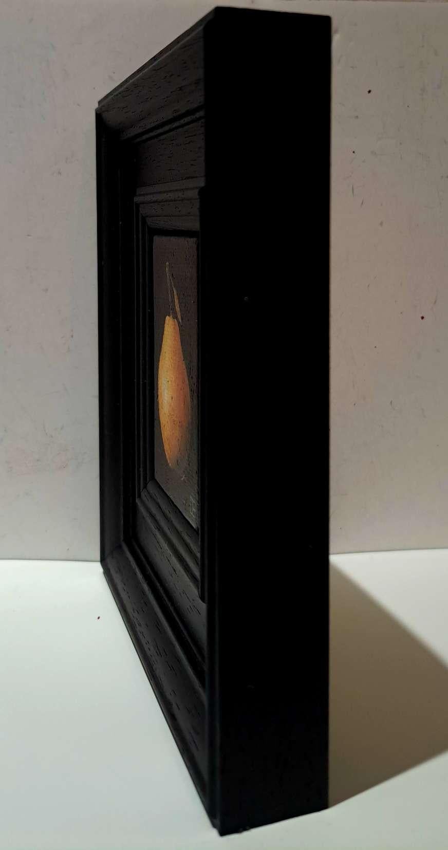 Pocket Blush Pear 7c is an original oil painting by Dani Humberstone as part of her Pocket painting series featuring small scale realistic oil paintings, with a nod to baroque still life painting. The paintings are set in a black wood layered