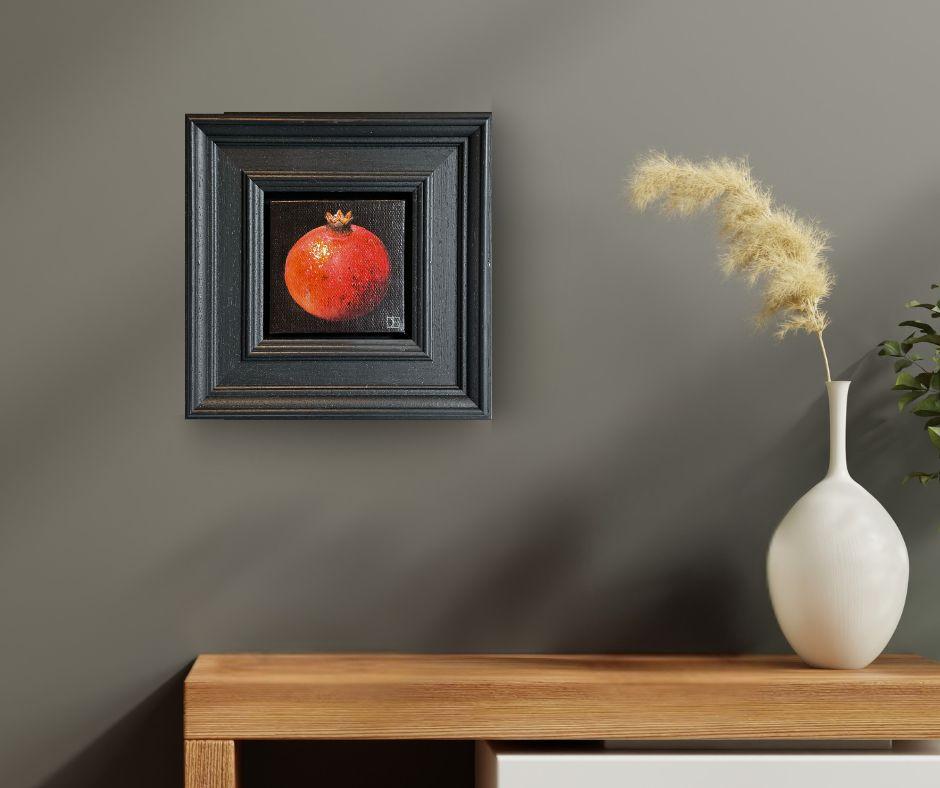 We offer complimentary worldwide shipping and cover all tariffs and import taxes for this artwork.

“Picked Pomegranate” by Dani Humberstone captures the regal complexity of its subject with exquisite clarity. Set against a shadowed, velvety black