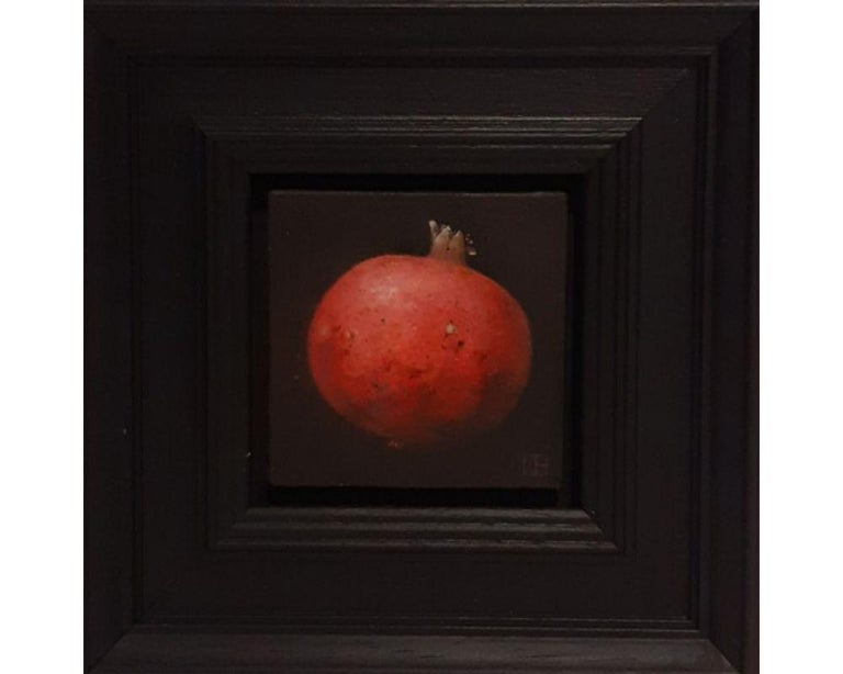 Pocket Bright Red Pomegranate by Dani Humberstone [2022]
Pocket Bright Red Pomegranate is an original oil painting by Dani Humberstone as part of her Pocket series featuring small scale realistic oil painting in a black layered frame. They nod to a