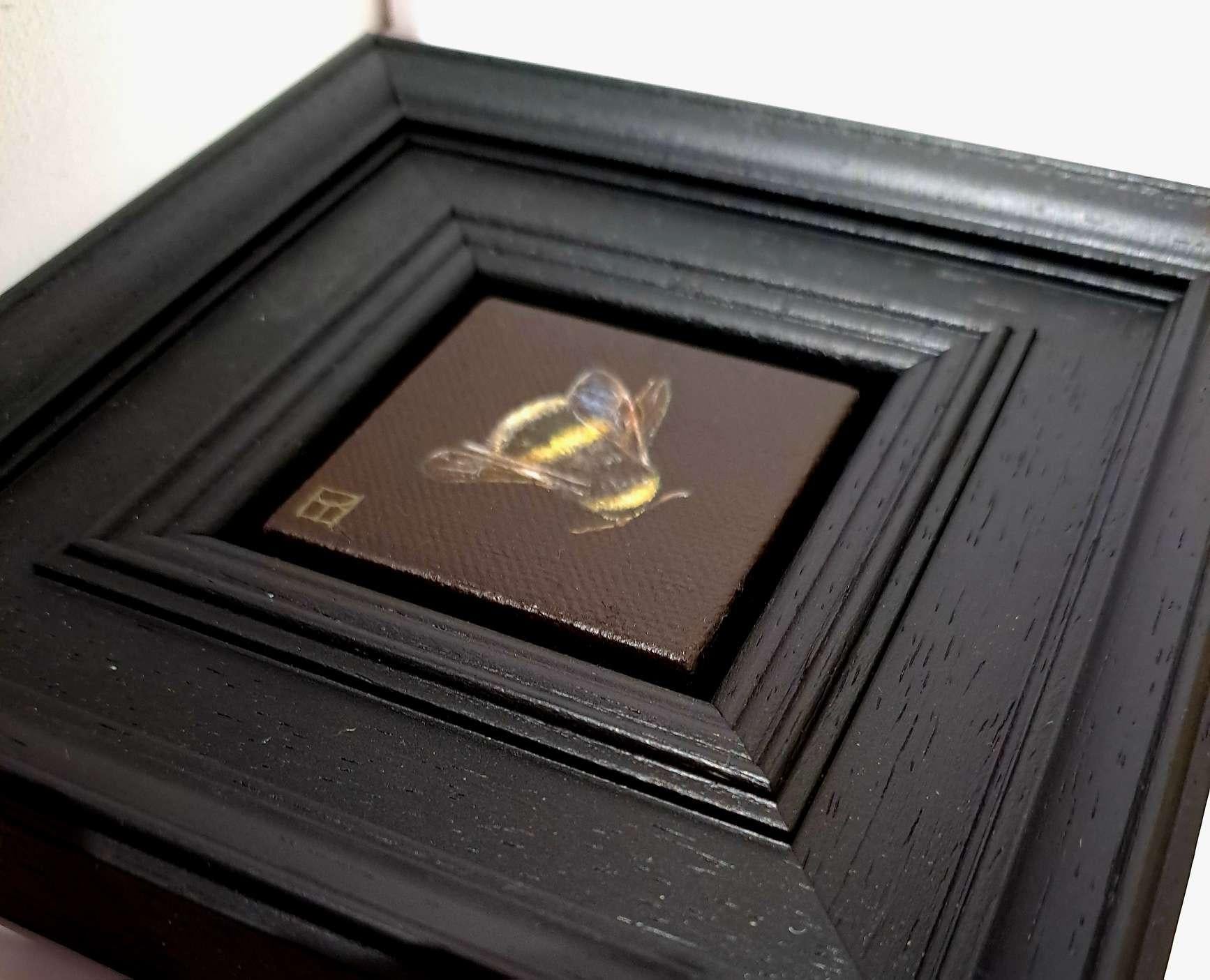 Pocket Bumble Bee 3 is an original oil painting by Dani Humberstone as part of her Pocket Painting series featuring small scale realistic oil paintings, with a nod to baroque still life painting. The paintings are set in a black wood layered