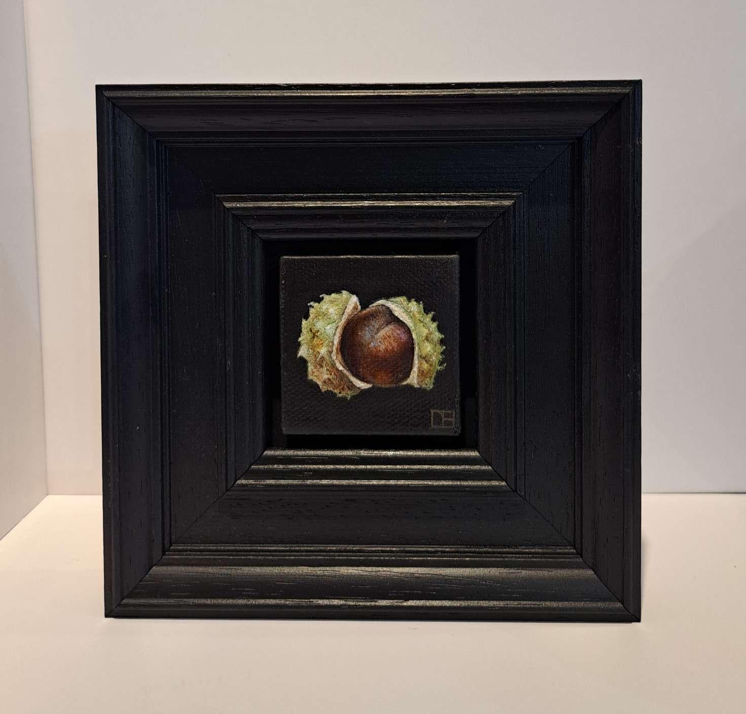 Pocket Conker and Shell 2 c is an original oil painting by Dani Humberstone as part of her Pocket Painting series featuring small scale realistic oil paintings, with a nod to baroque still life painting. The paintings are set in a black wood layered