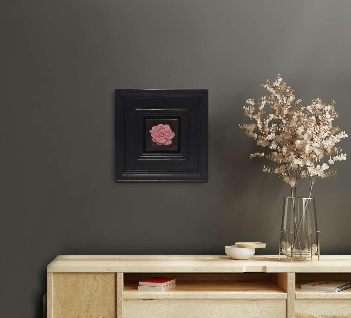 Pocket Pink Rose with Leaf is an original oil painting by Dani Humberstone as part of her Pocket Painting series featuring small scale realistic oil paintings, with a nod to baroque still life painting. The paintings are set in a black wood layered