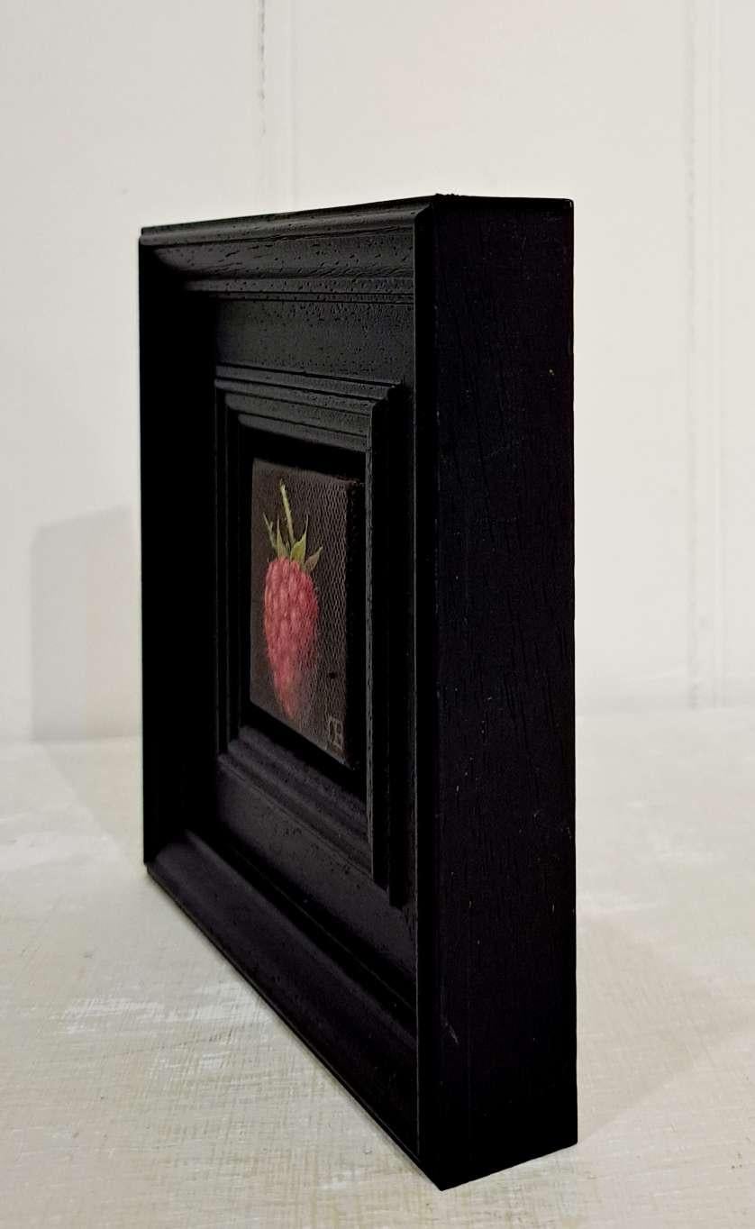 Pocket Raspberry is an original oil painting by Dani Humberstone as part of her Pocket Painting series featuring small scale realistic oil paintings, with a nod to baroque still life painting. The paitings are set in a black wood layered